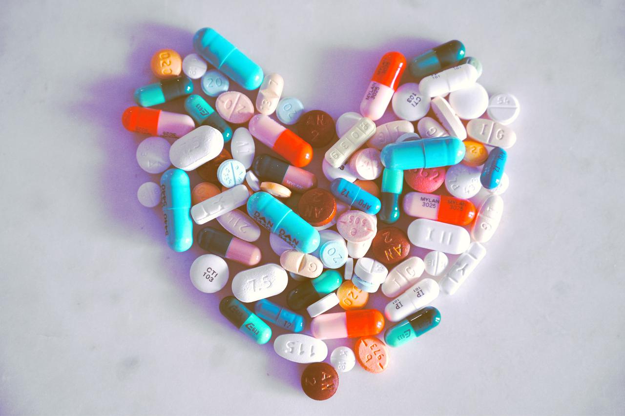 A compiled bunch of pills shaped into a heart, because art. 