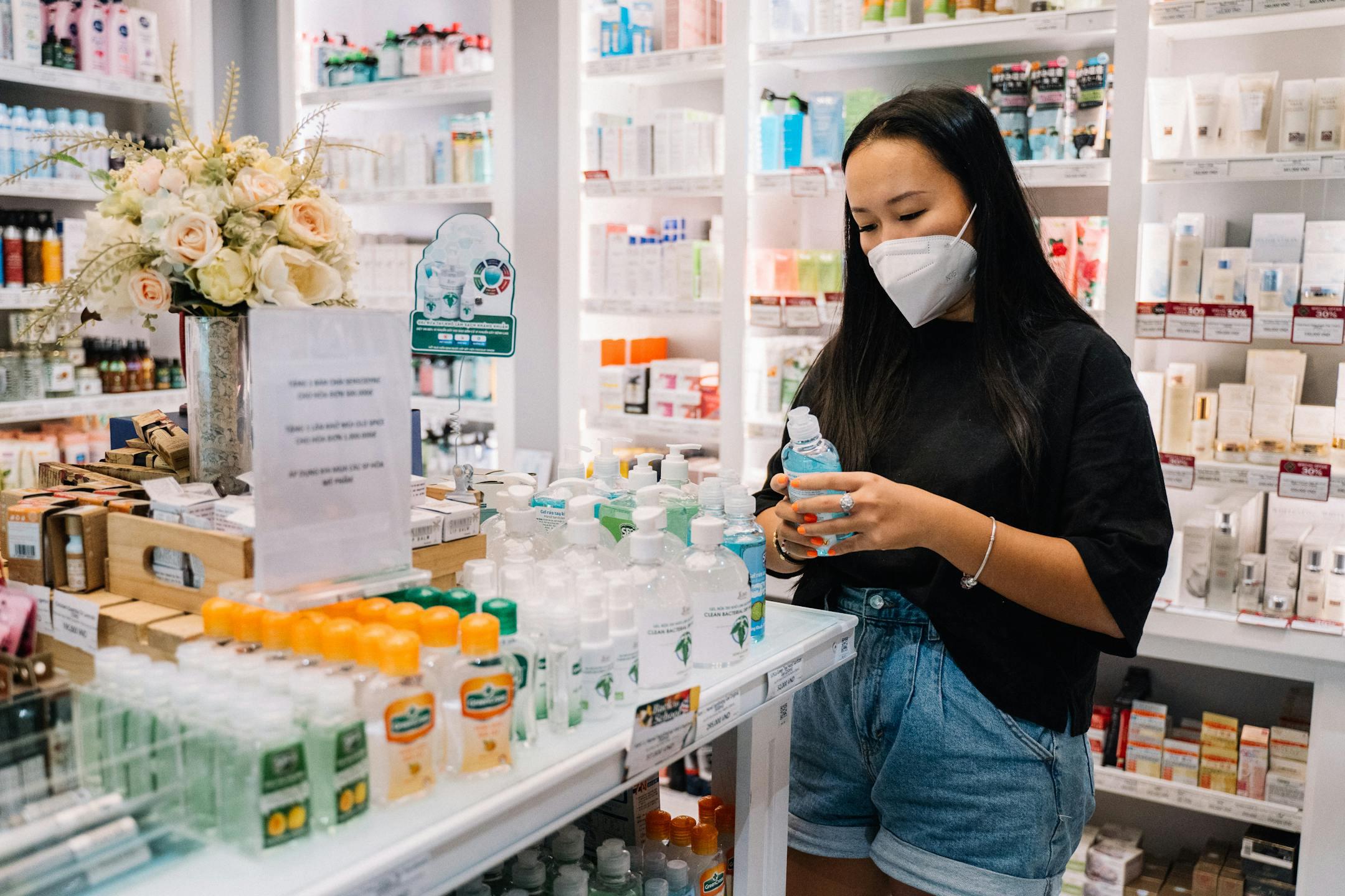Girl wondering "can I buy gonorrhea treatment online?" as she shops in a pharmacy