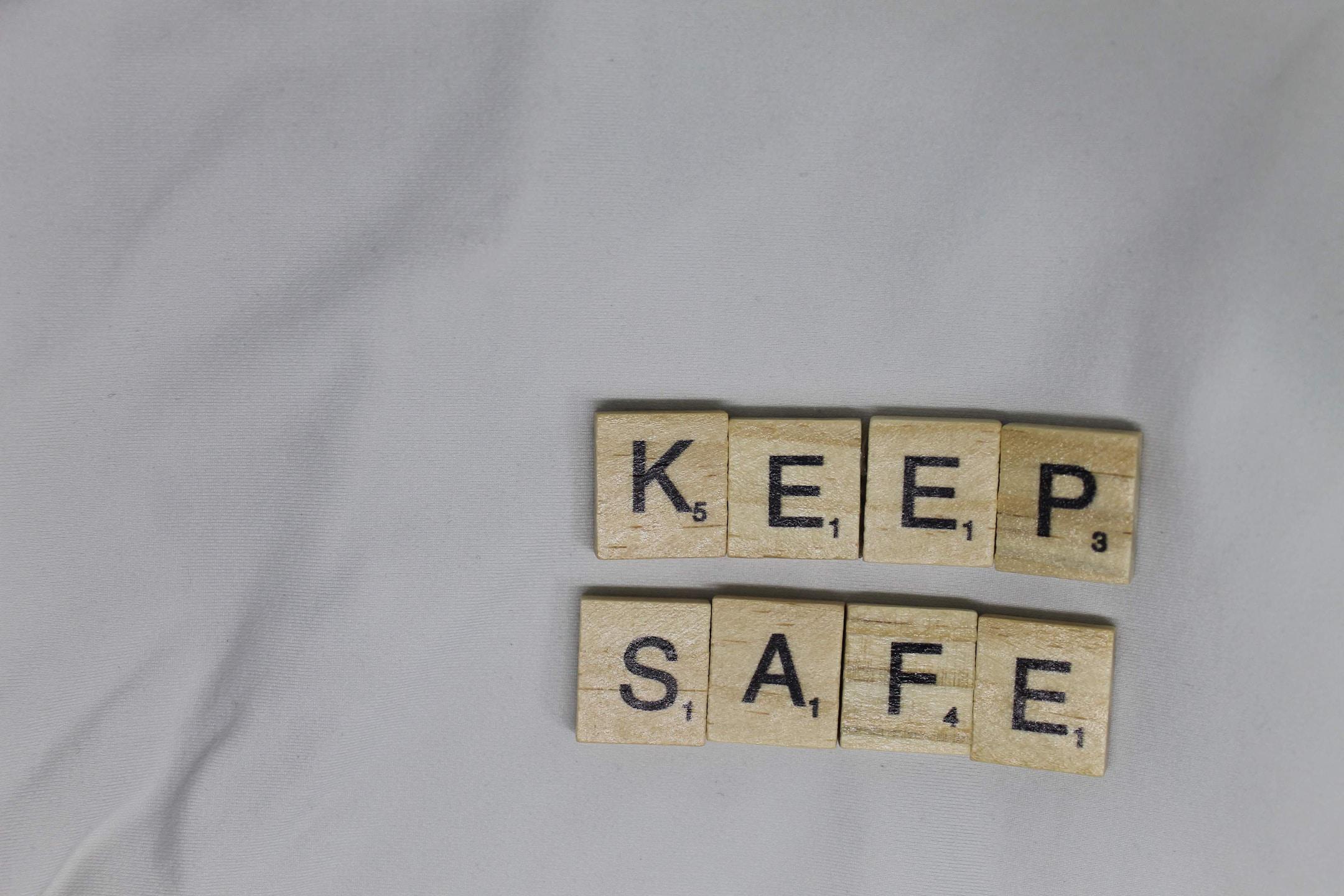 KEEP SAFE letter tiles on white background