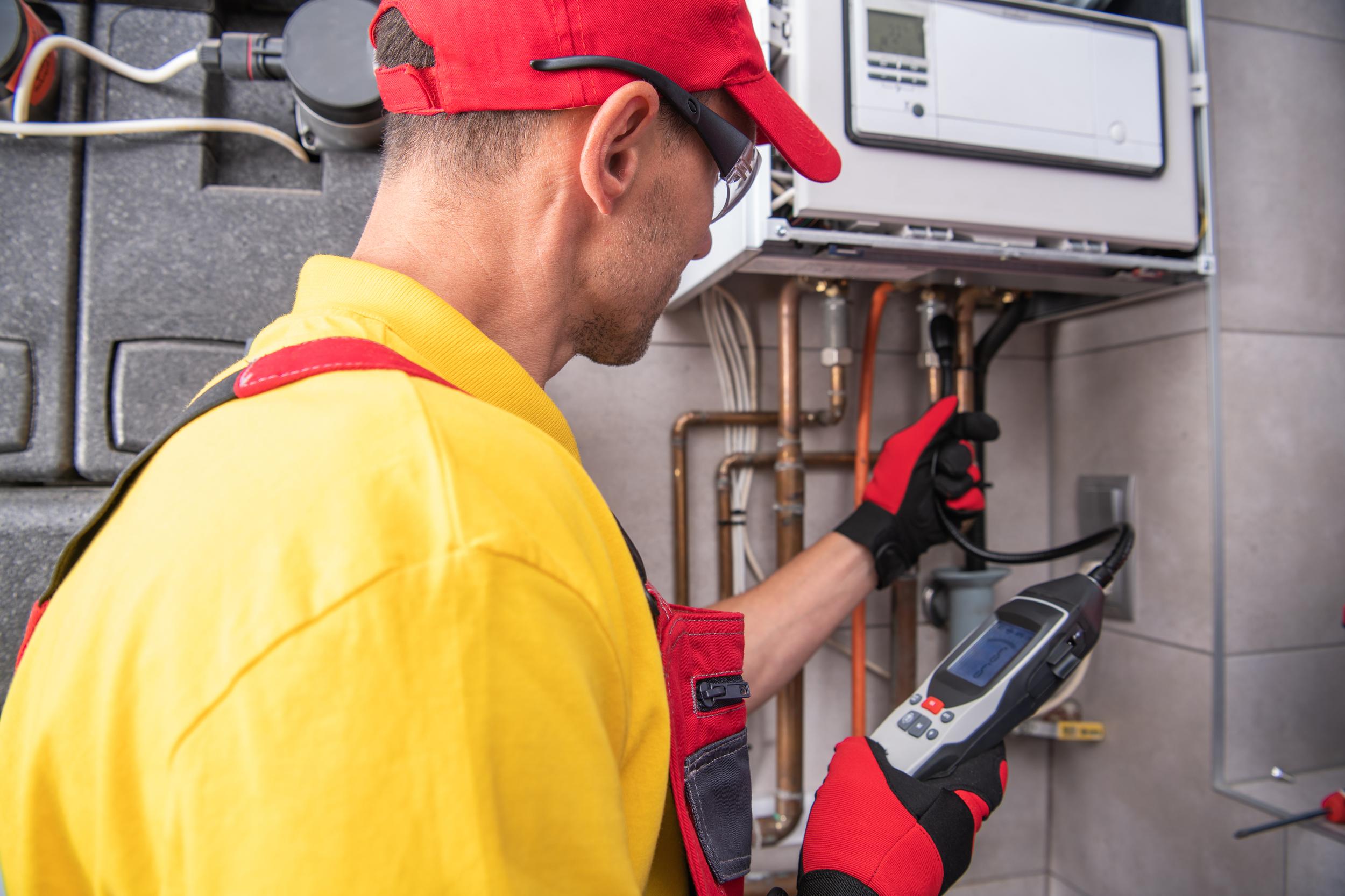 technician-performs-maintenance-on-heating-system-2026-01-09-13-44-43-utc.jpg