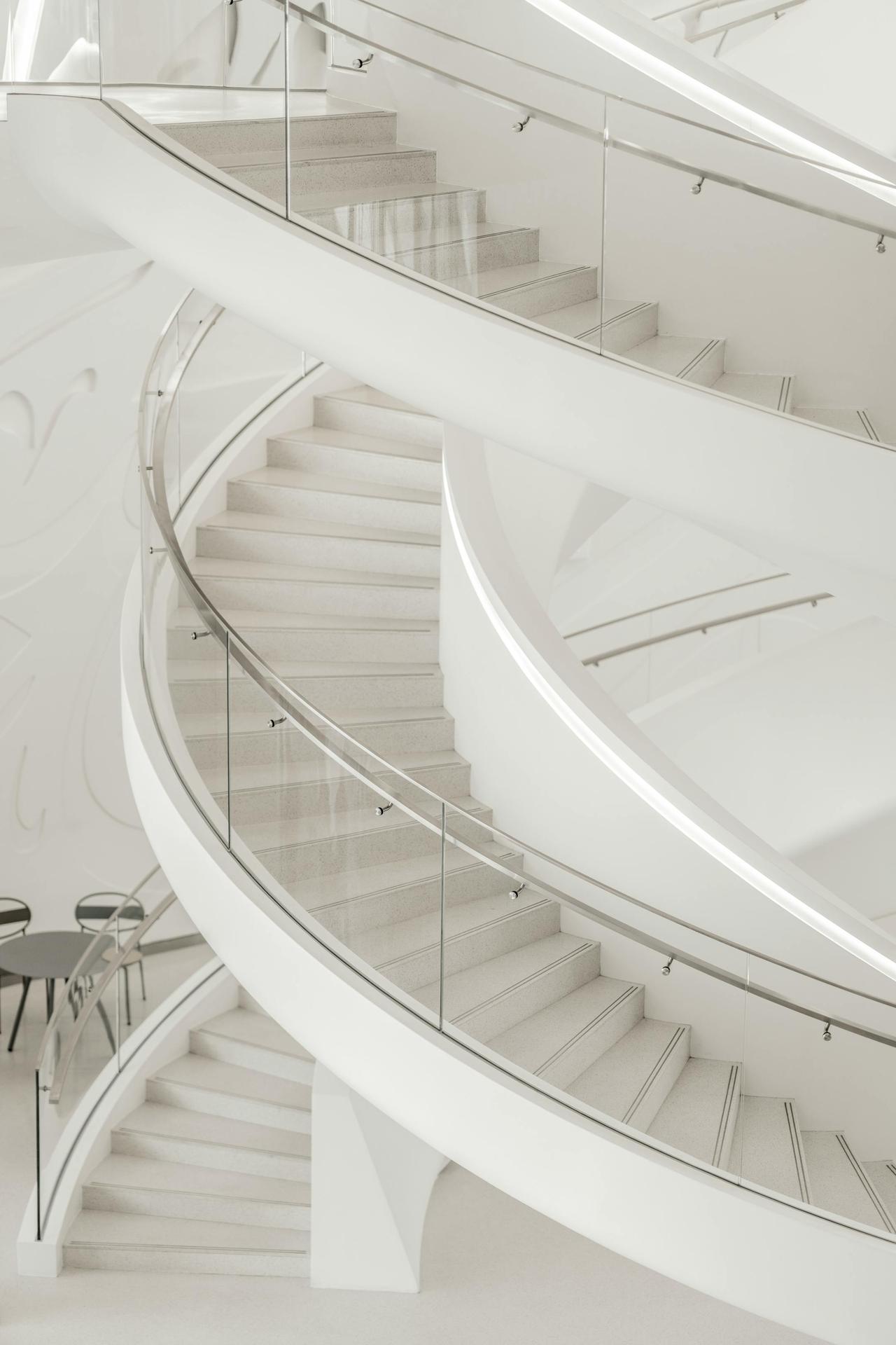 Elegant white spiral staircase showcasing modern architecture design in Dubai.