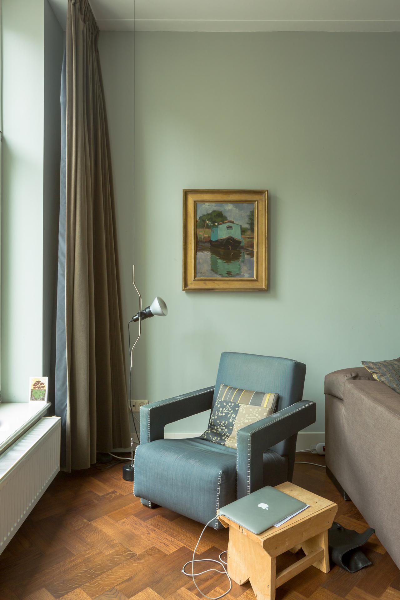 interior with chair and lamp by the window