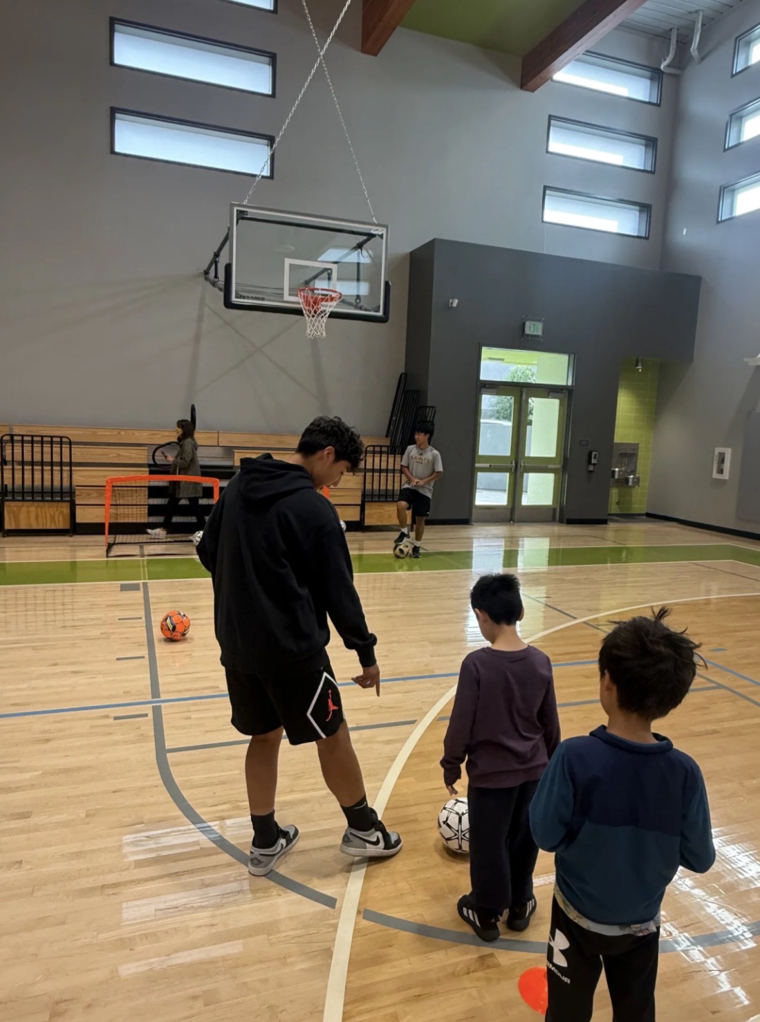 Coaches mentoring young soccer players