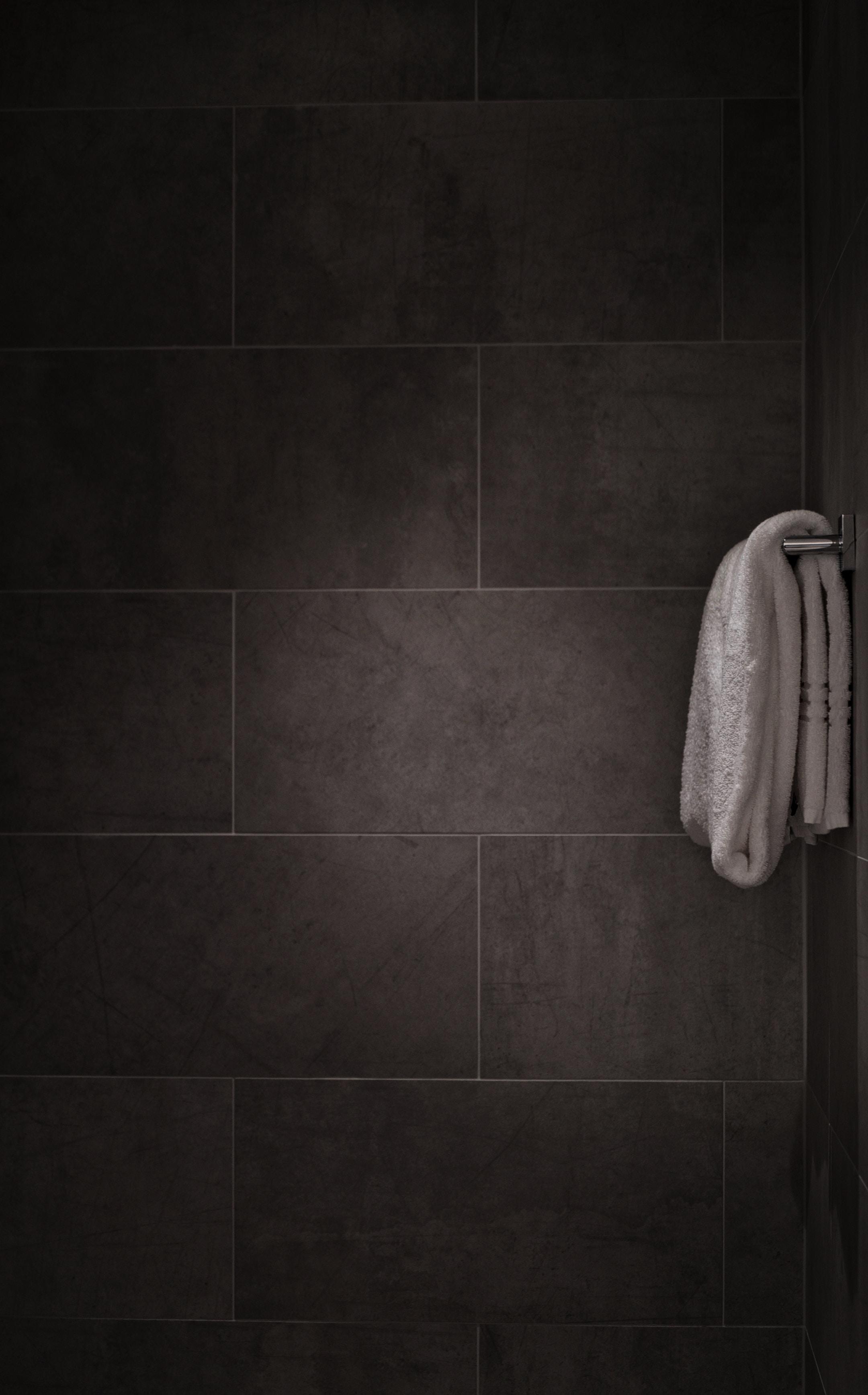 white towel in tiled bathroom