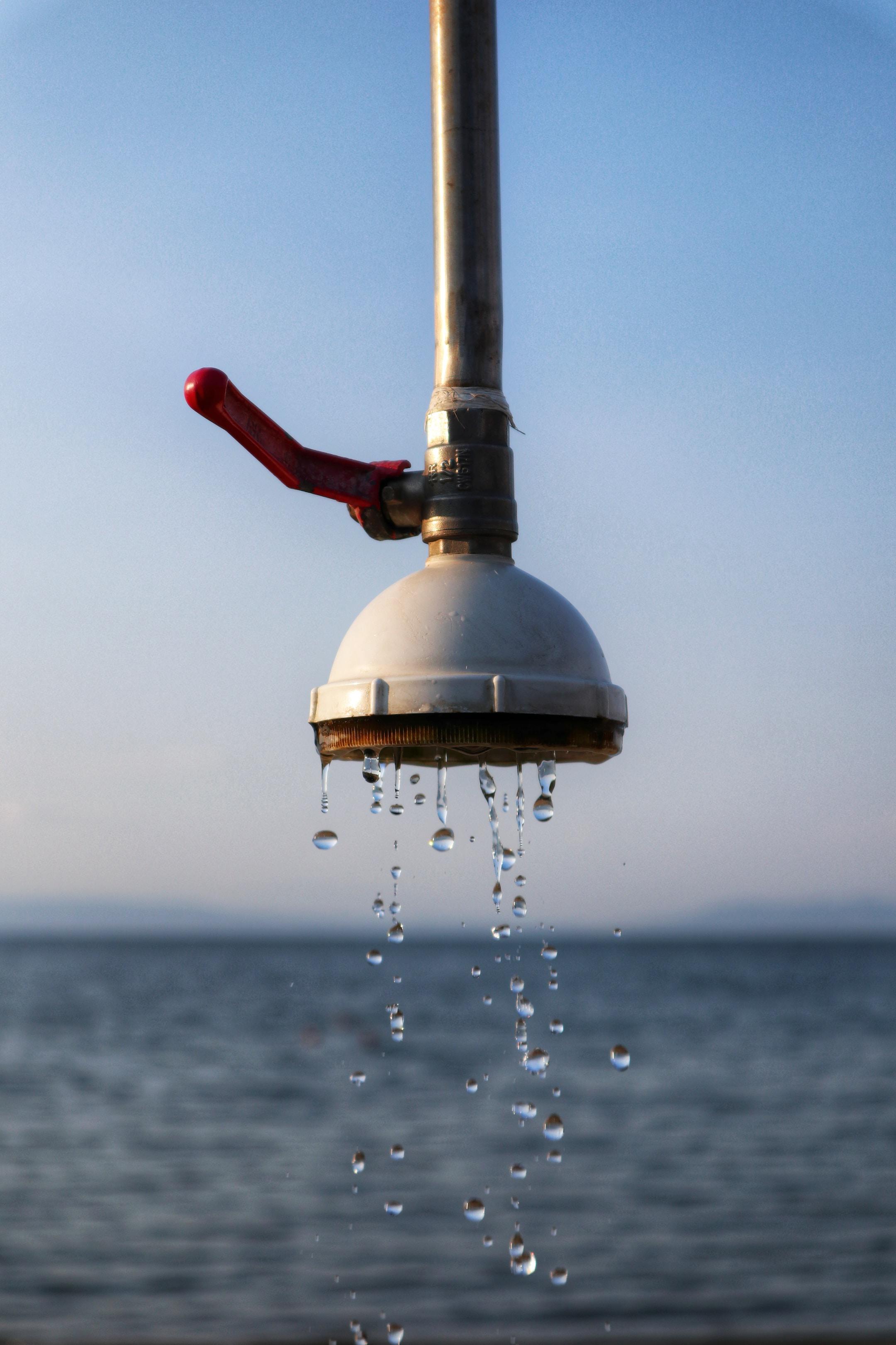 Water dripping from a beach shower. 