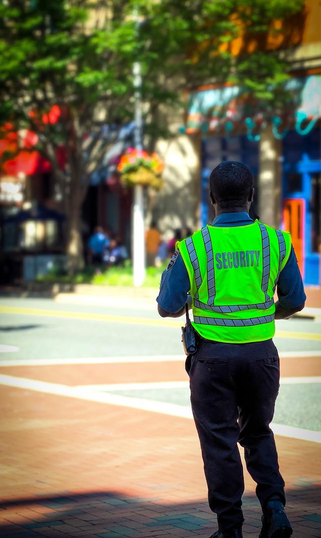 A security guard monitoring an intersection.