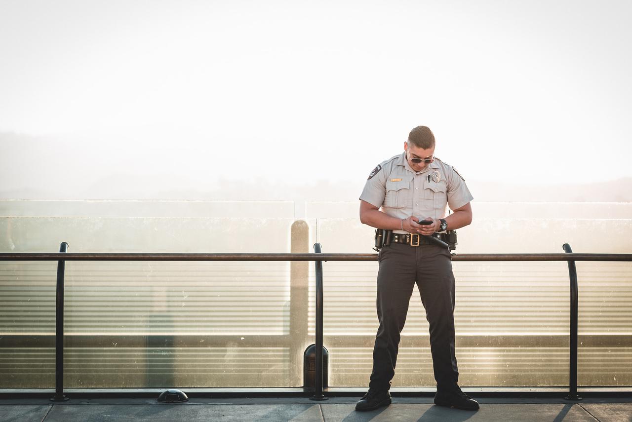 Image of a guy looking up what to do about a lost security guard license in Ontario.