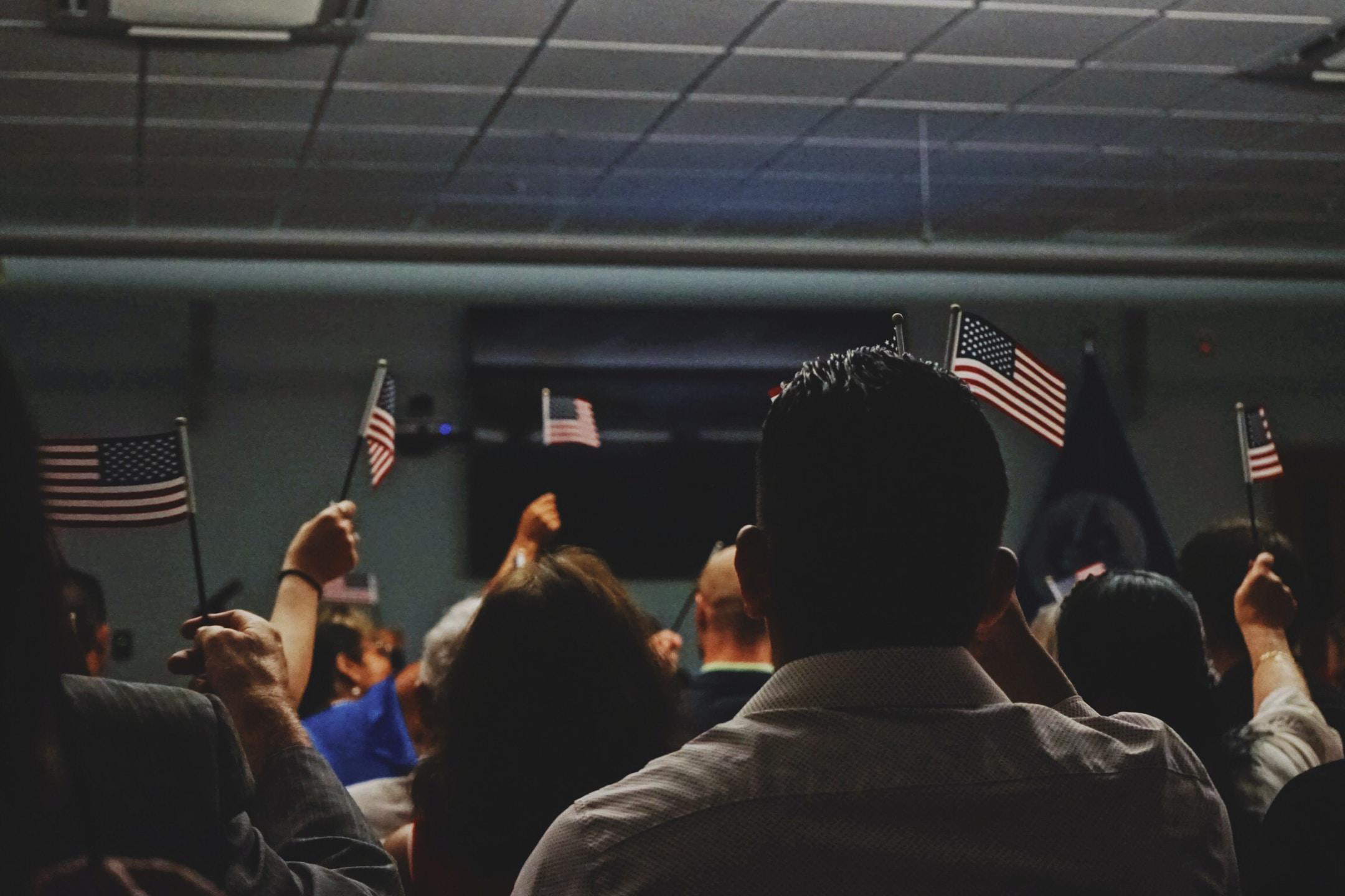 new US citizens being sworn in at a ceremony