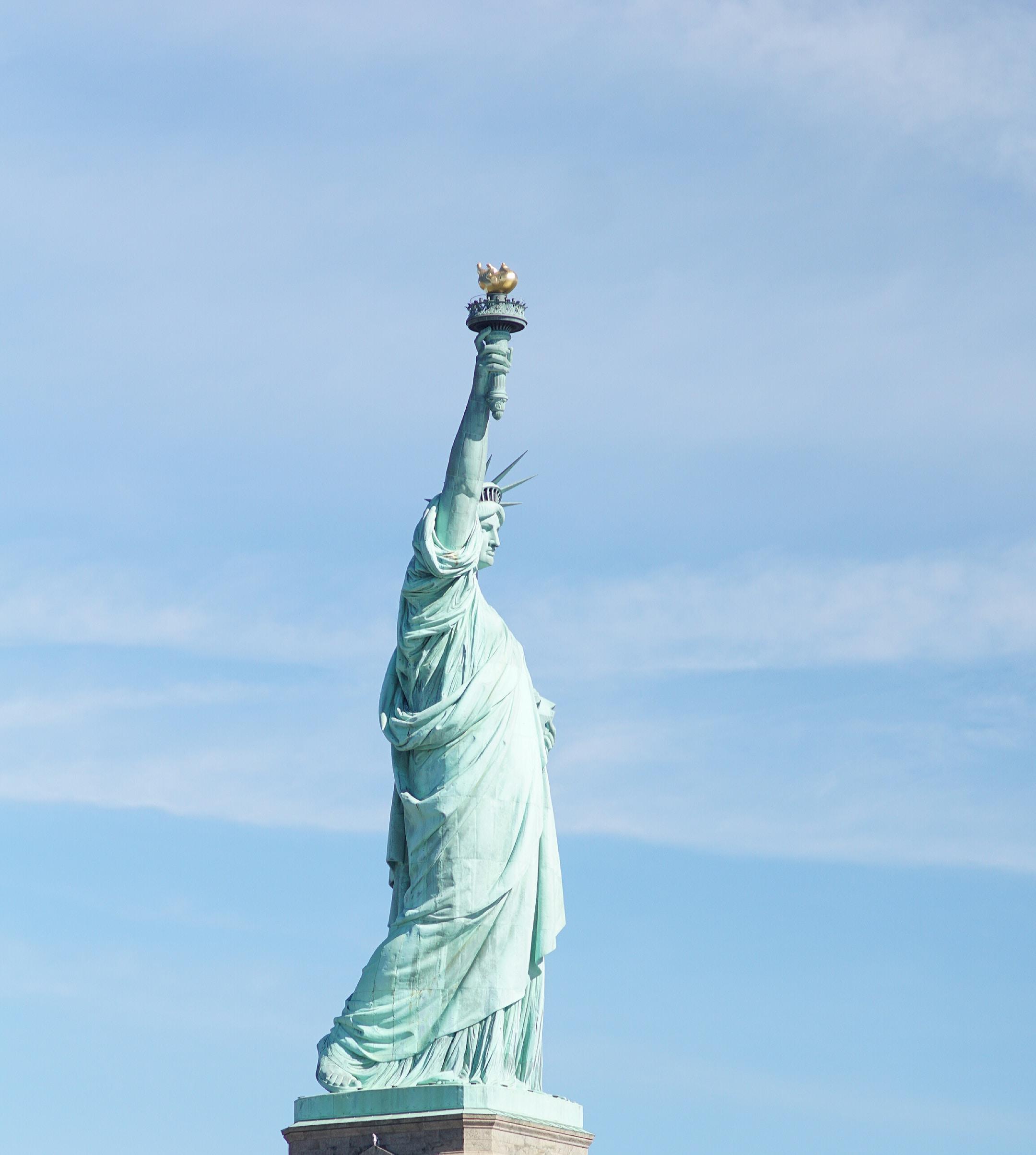 Image of that statue of liberty, a symbol of citizenship for those who work with immigration lawyers in Tampa.