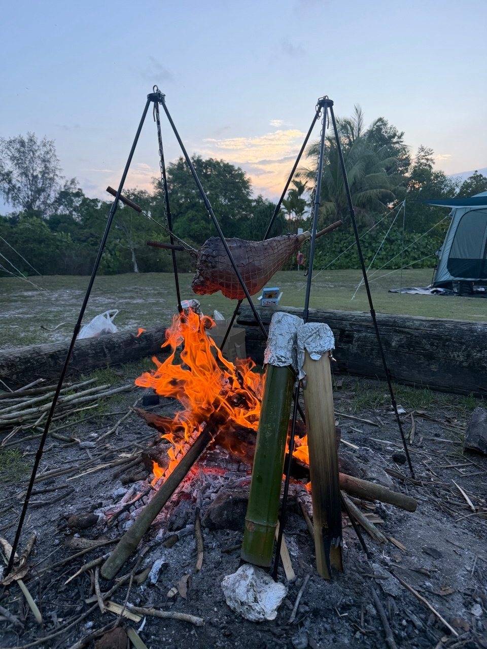 Participants learning outdoor cooking skills during the Pulau Ubin adventure