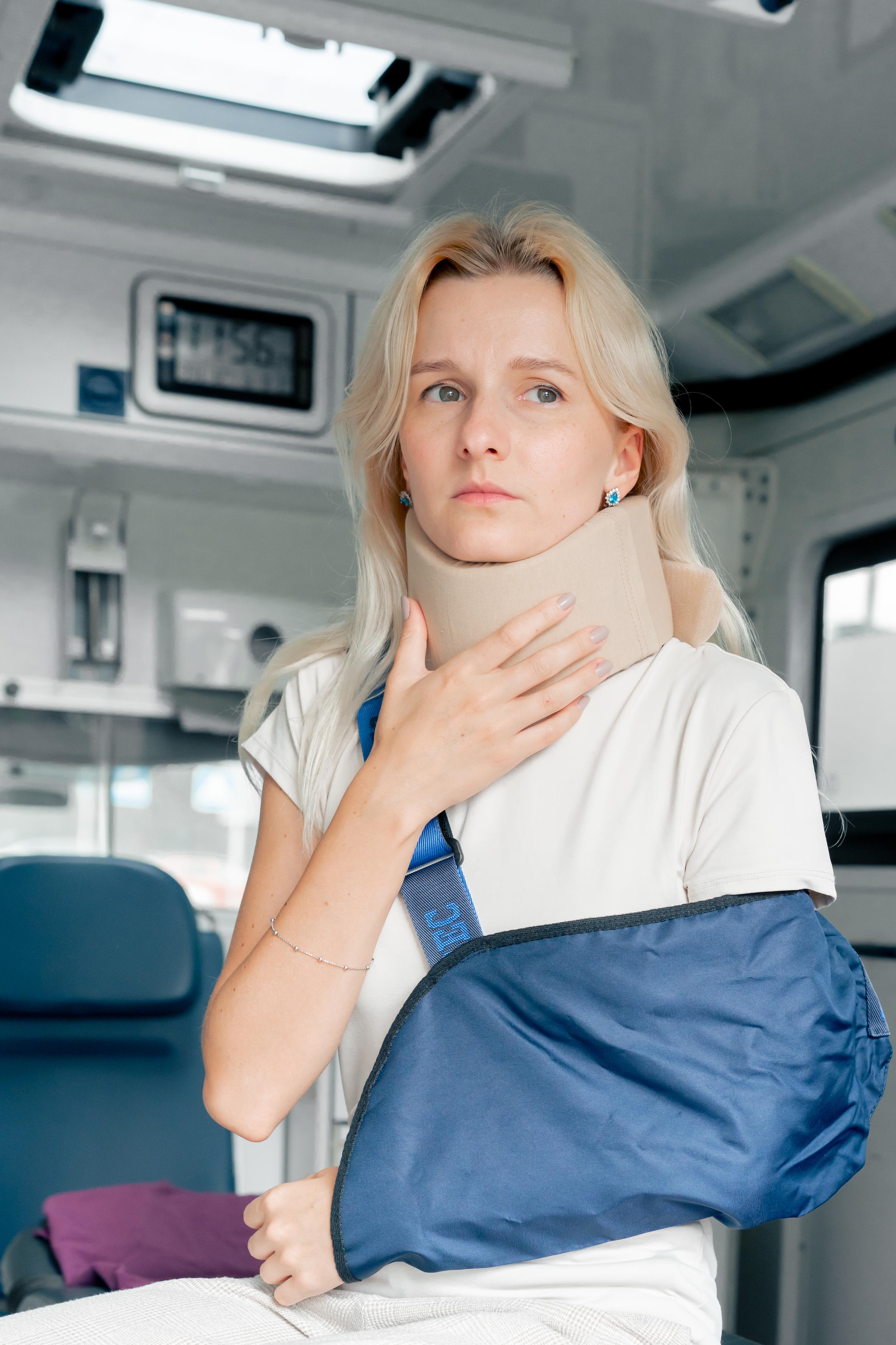 woman-with-injured-arm-and-neck-brace-2026-09-22-23-20-17-utc.jpg