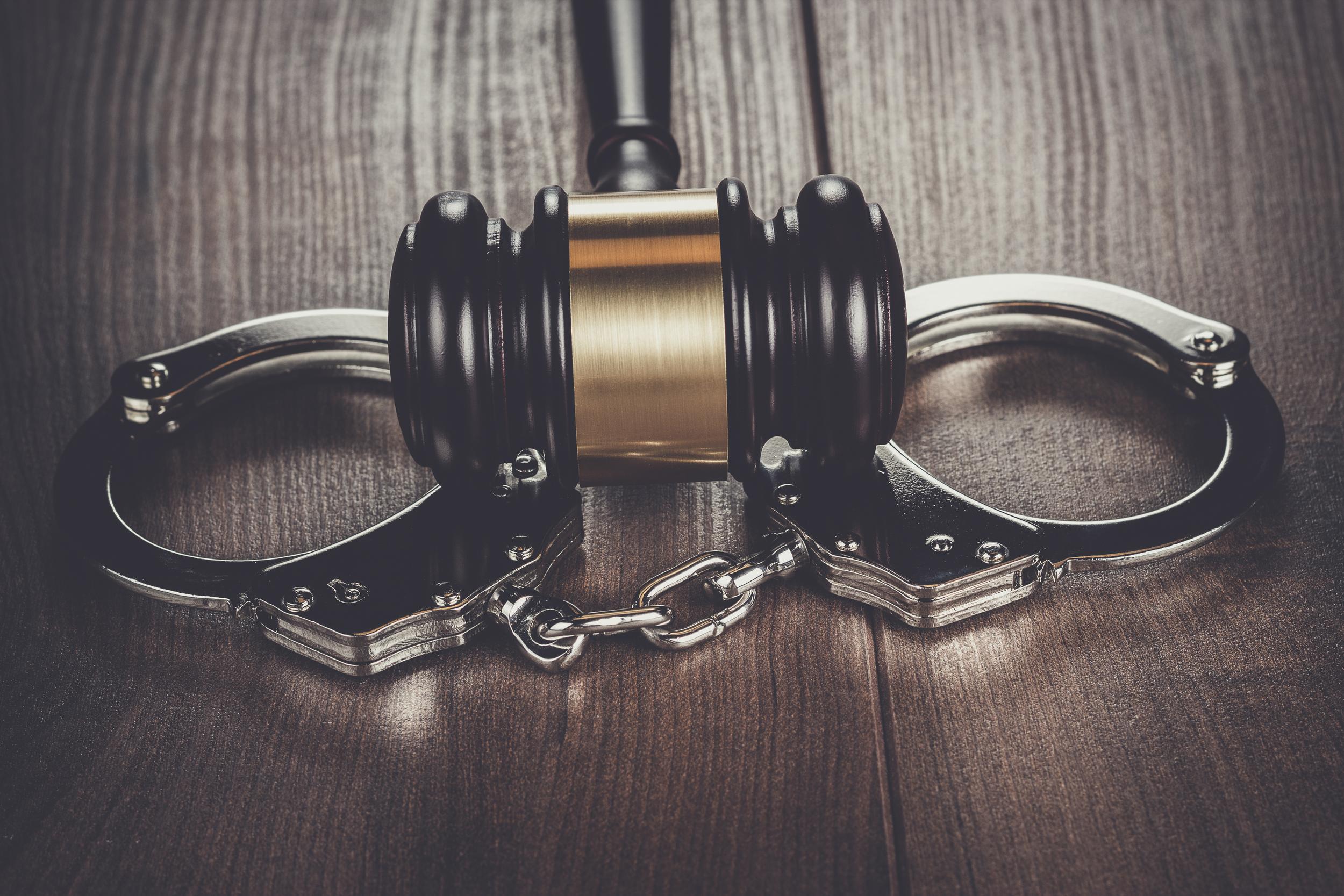 gavel-and-handcuffs-on-wooden-table-2026-09-23-05-18-42-utc.jpg