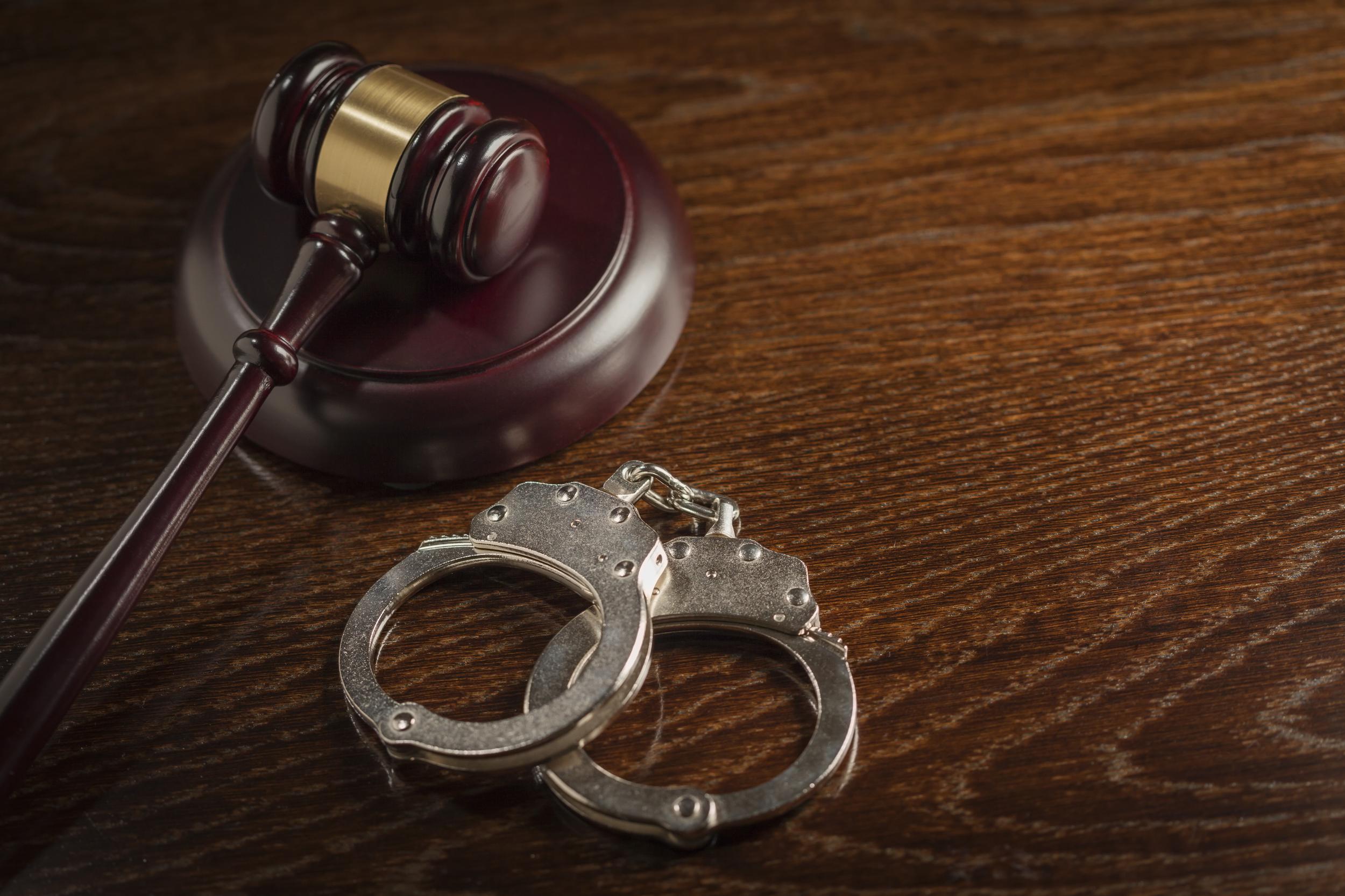 gavel-handcuffs-and-justice-on-a-wooden-table-2026-09-22-13-37-31-utc.jpg