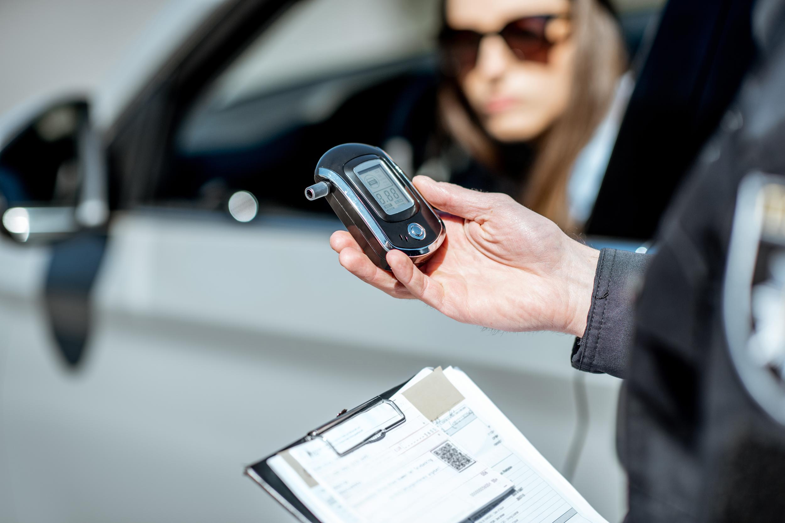 police-officer-administering-breathalyzer-test-to-2026-09-23-23-32-53-utc.jpg
