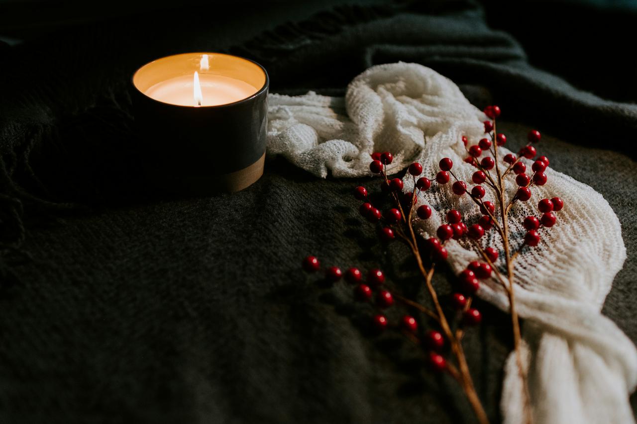 Berries and a candle on a table
