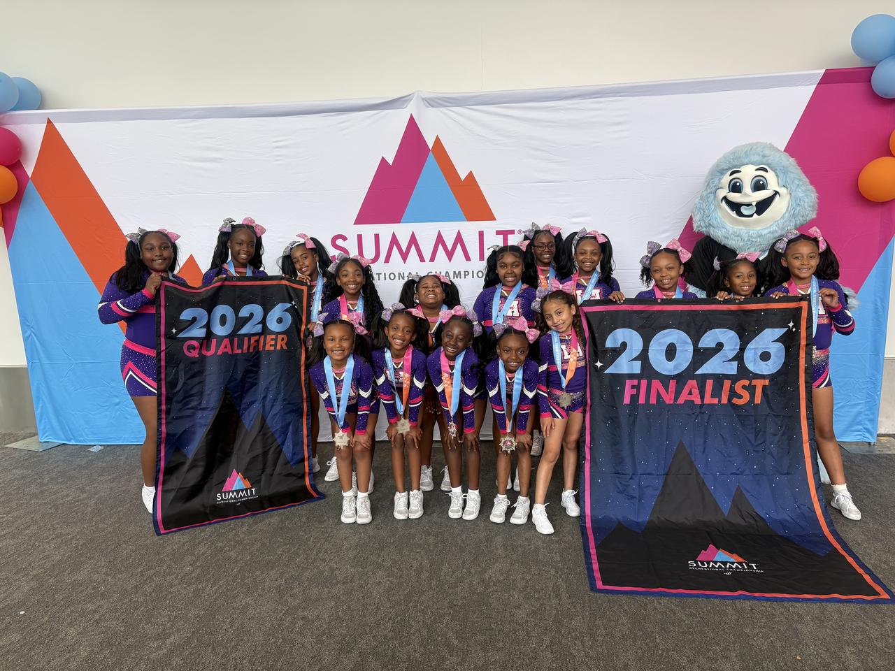 Cheerleaders performing a spectacular pyramid stunt