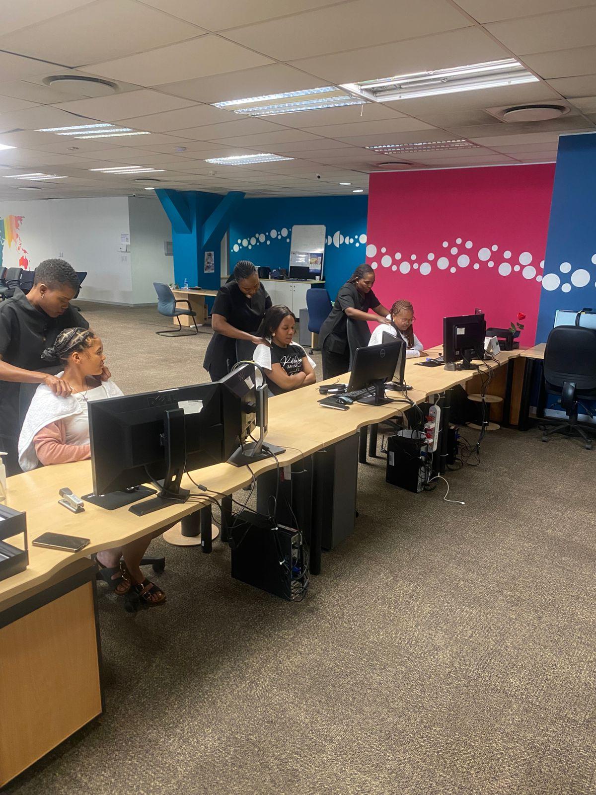 mobile spa sa at an office in parktown giving desk massages to staff