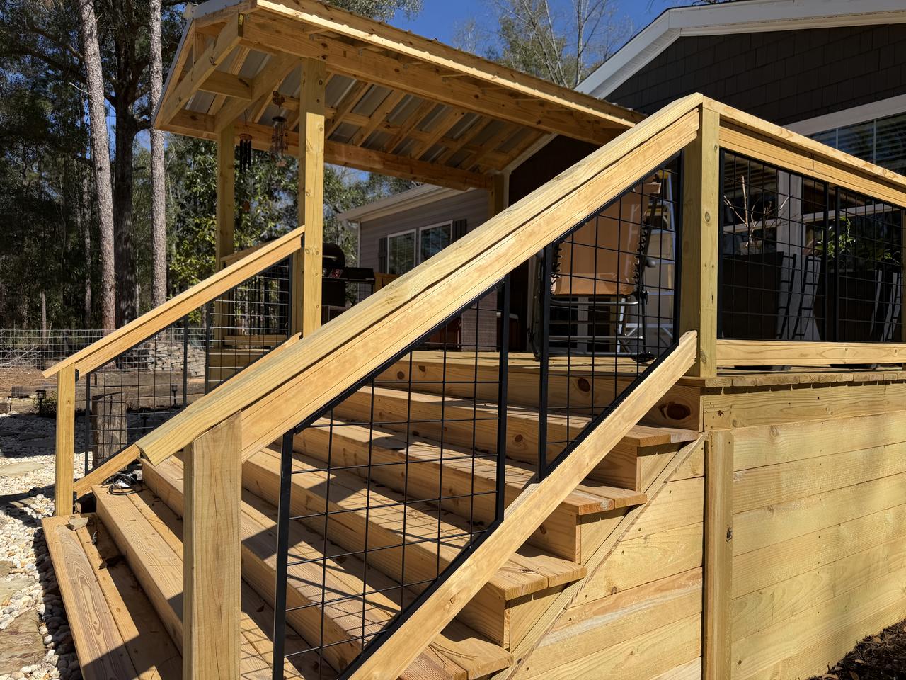 Magic Acres Farm custom patio with hogwire handrails and gable roof in Elberta Alabama