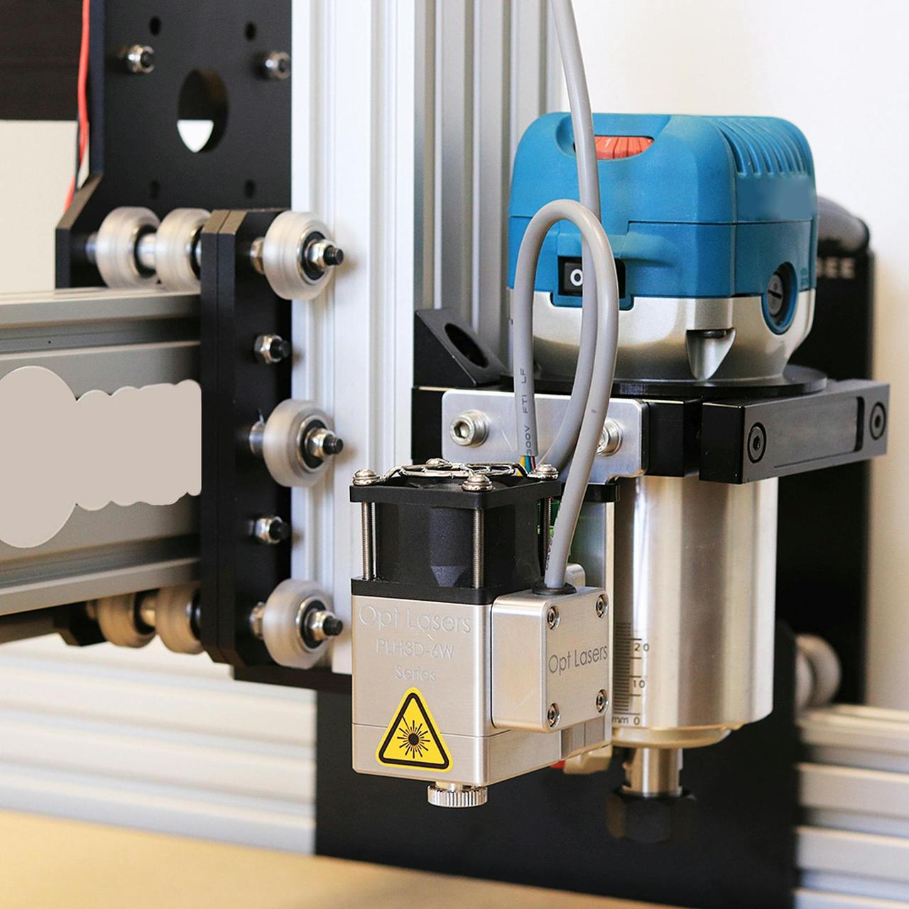 Detailed view of a CNC laser machine setup for precision cutting in a workshop.