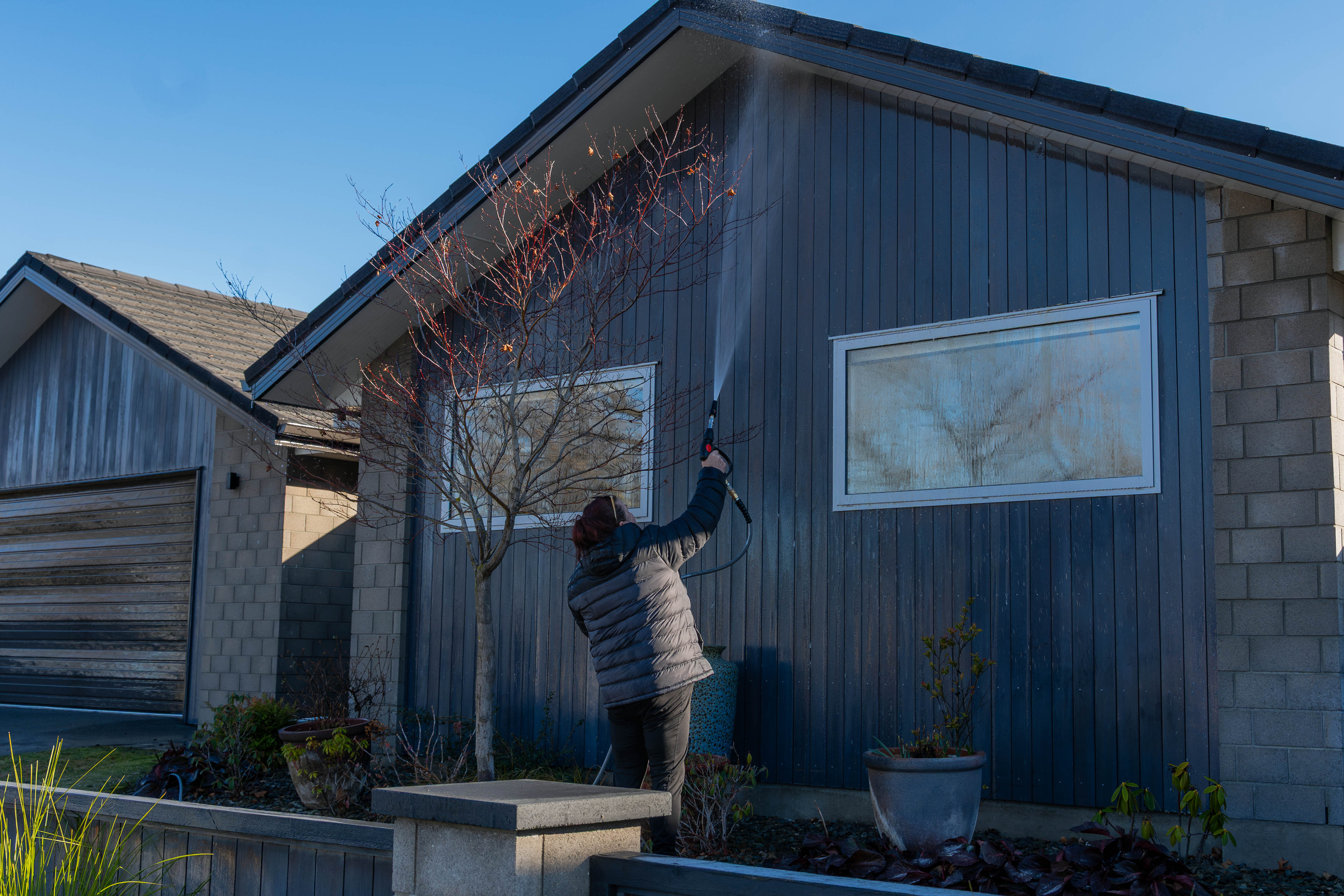 Exterior showing spider webs and cobwebs around eaves and corners