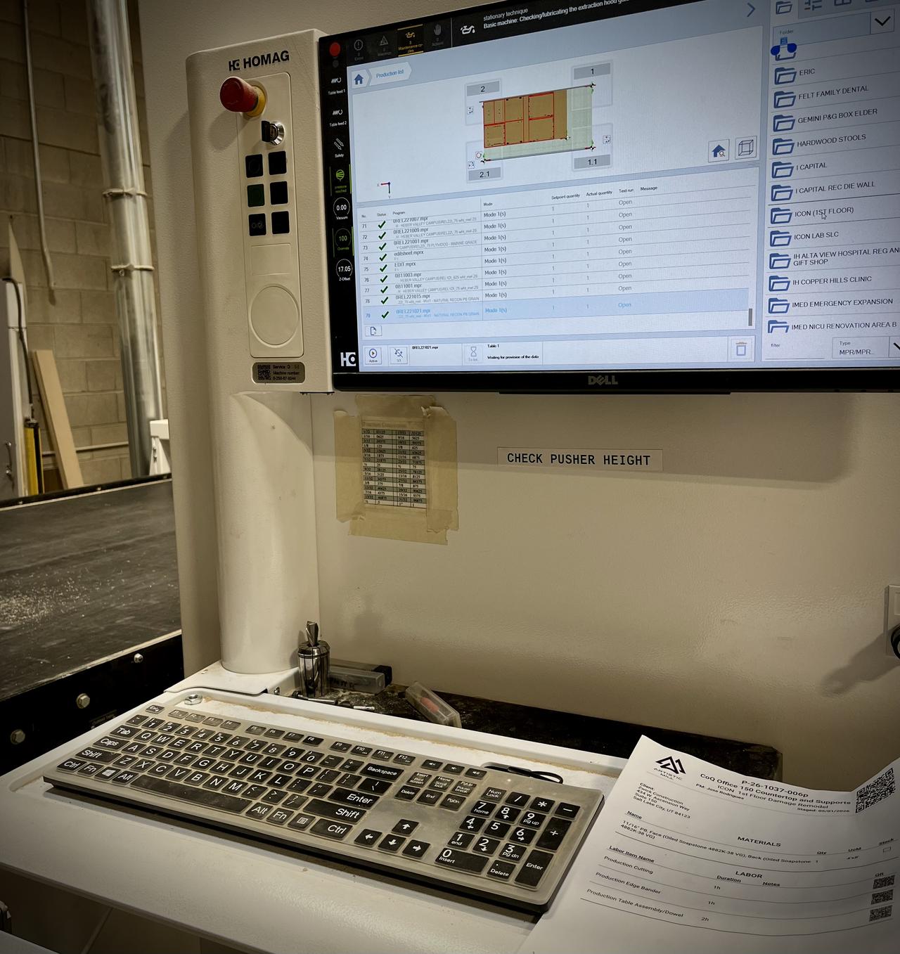 Quality control and finishing area with completed cabinet components