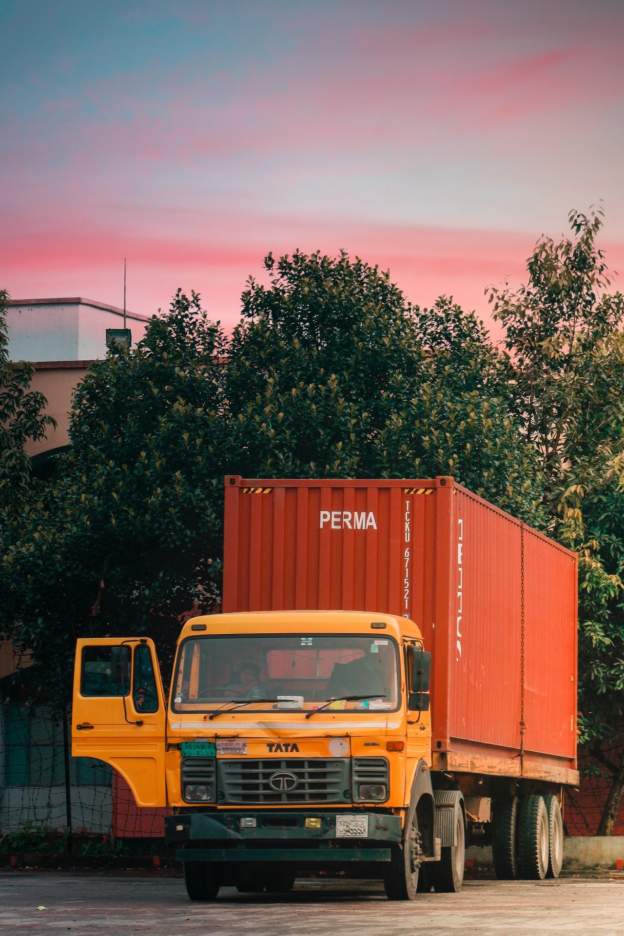 A freight truck stopped with the side door open.