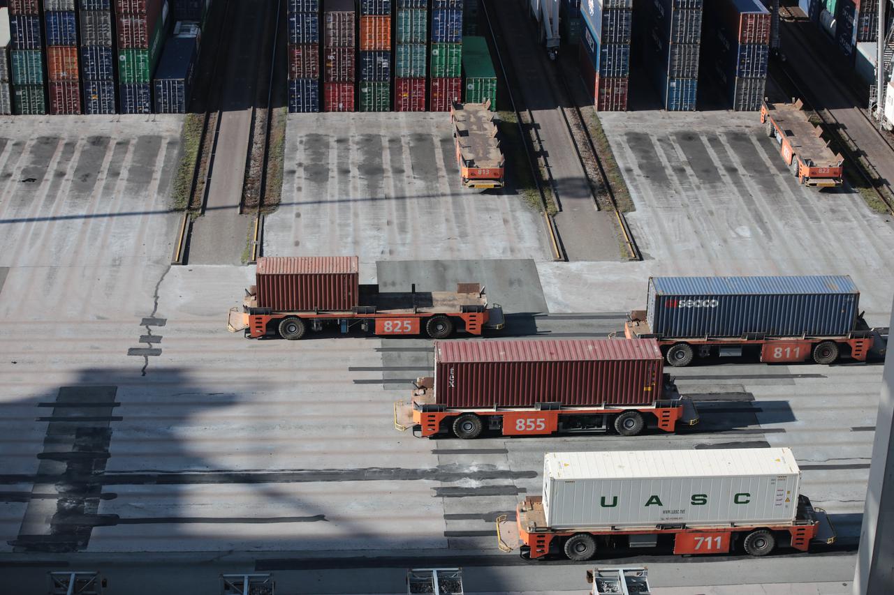 Automated Guided Vehicles carrying containers at Port of Rotterdam