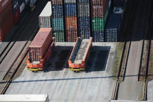Automated Guided Vehicles carrying containers at Port of Rotterdam 