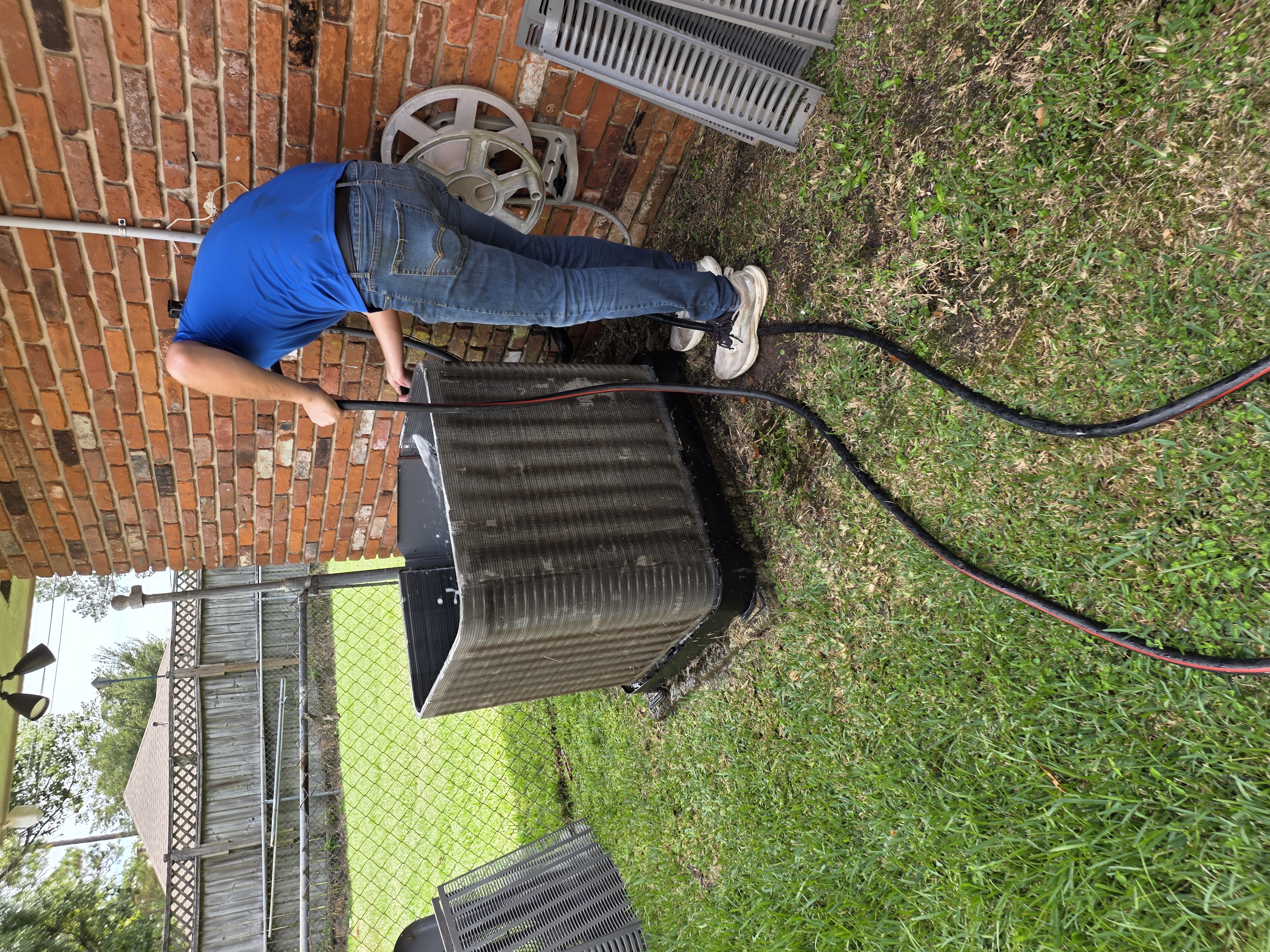 Professional HVAC technician working on air conditioning unit