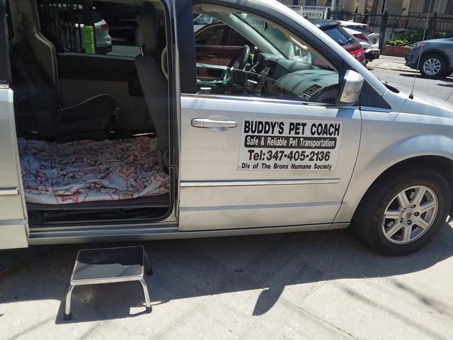 A stool to help pets into a company van.