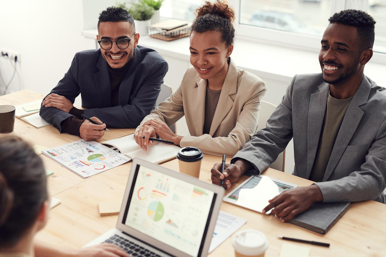 Four employees at an executive coaching session in Michigan.