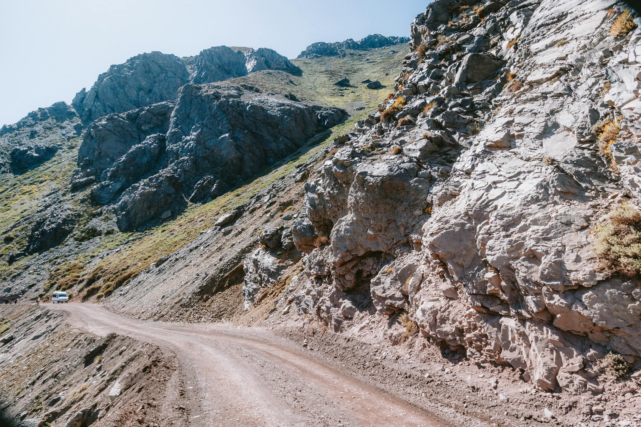 A scenic mountain road winding through the Andes in San José de Maipo, Chile.