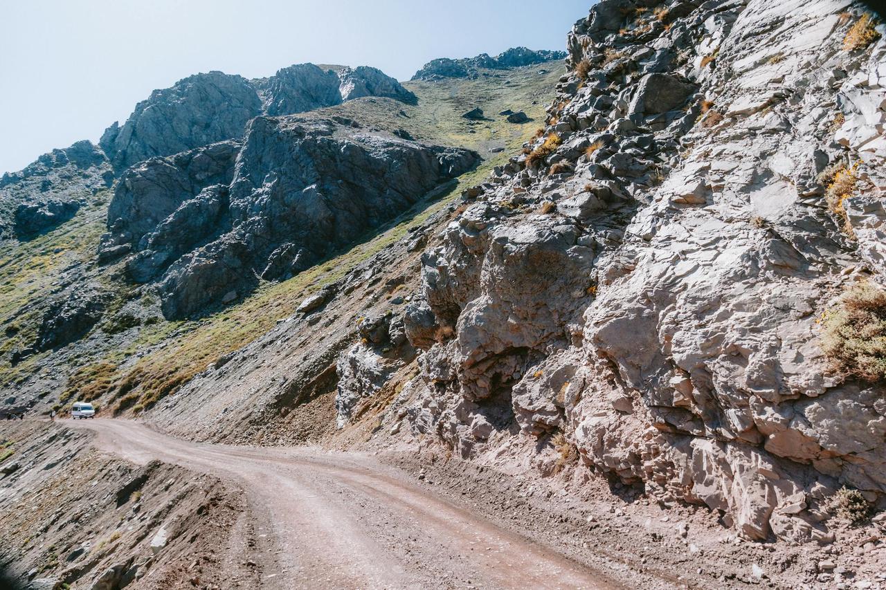 A scenic mountain road winding through the Andes in San José de Maipo, Chile.