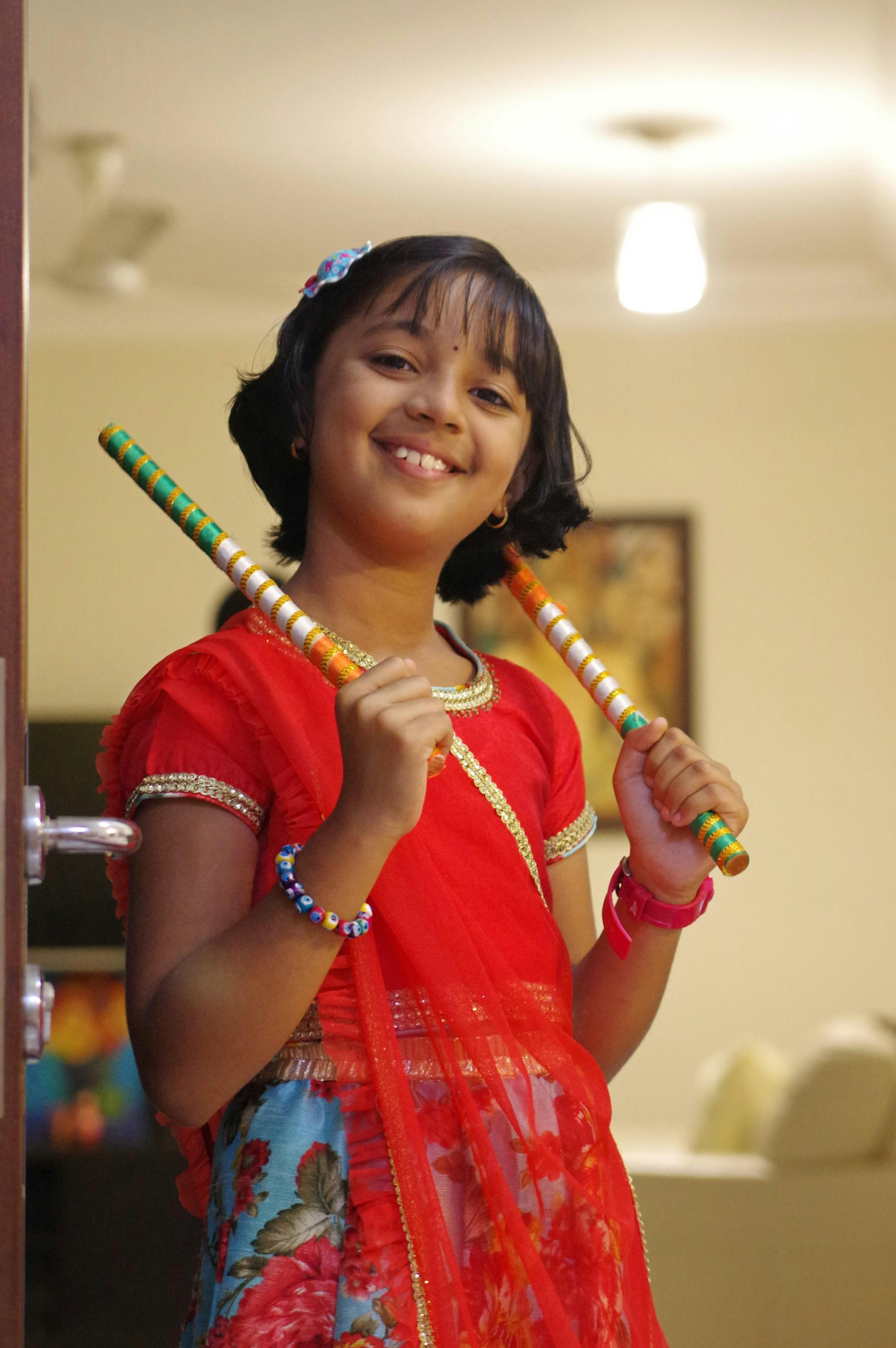 Little girl all decked up in traditional Indian dress as she gets ready to participate in the traditional "Garba" dance.