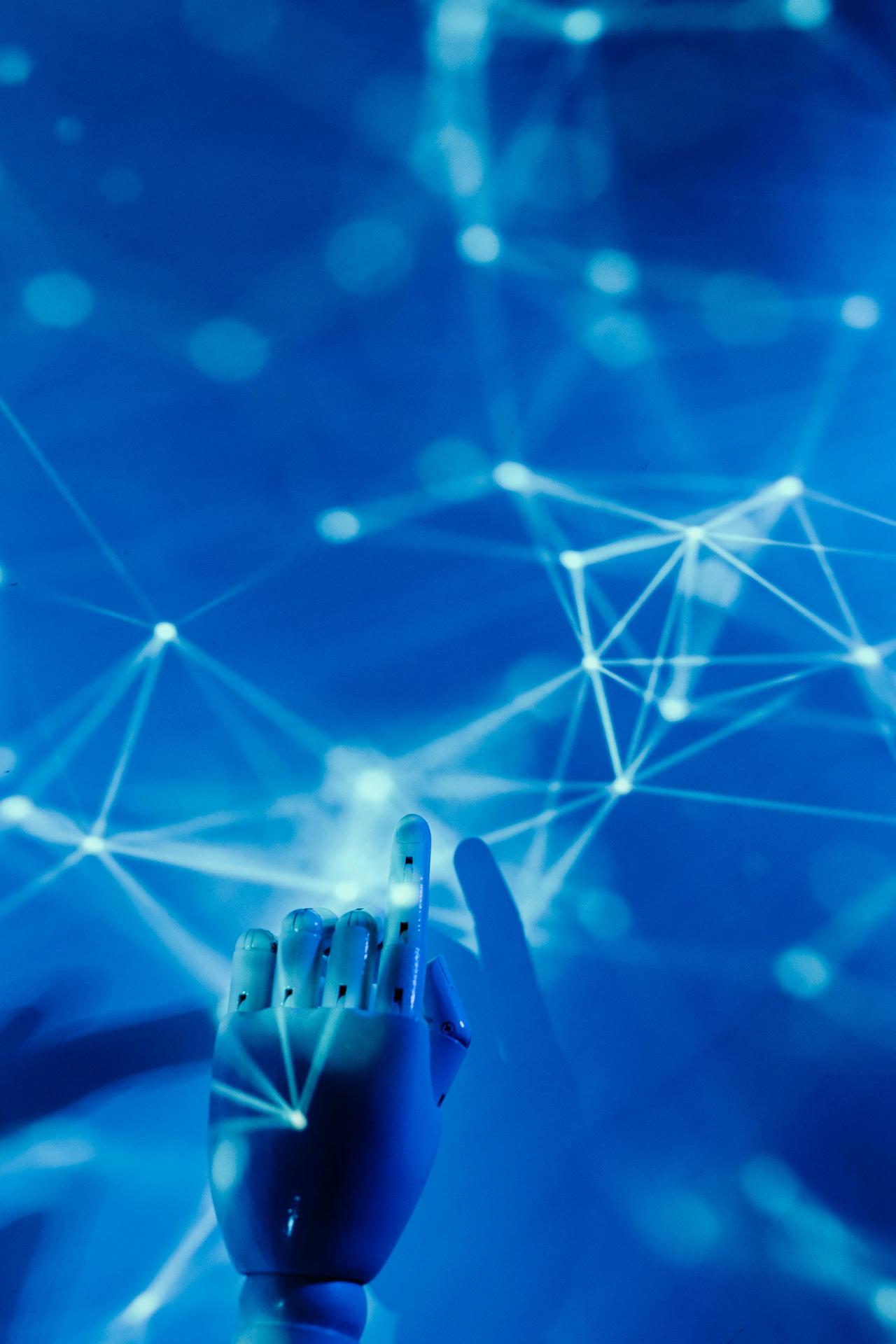 Futuristic robotic hand touching a digital network on a blue background.
