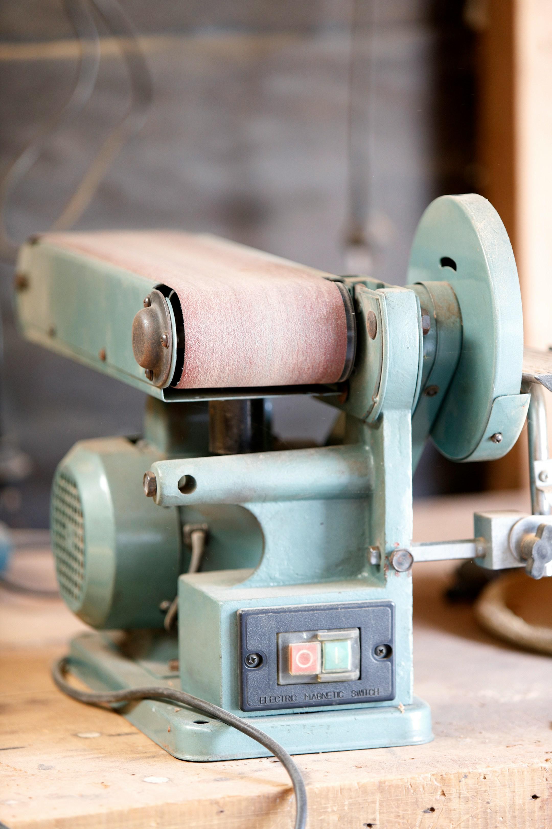 Belt sander on a workbench