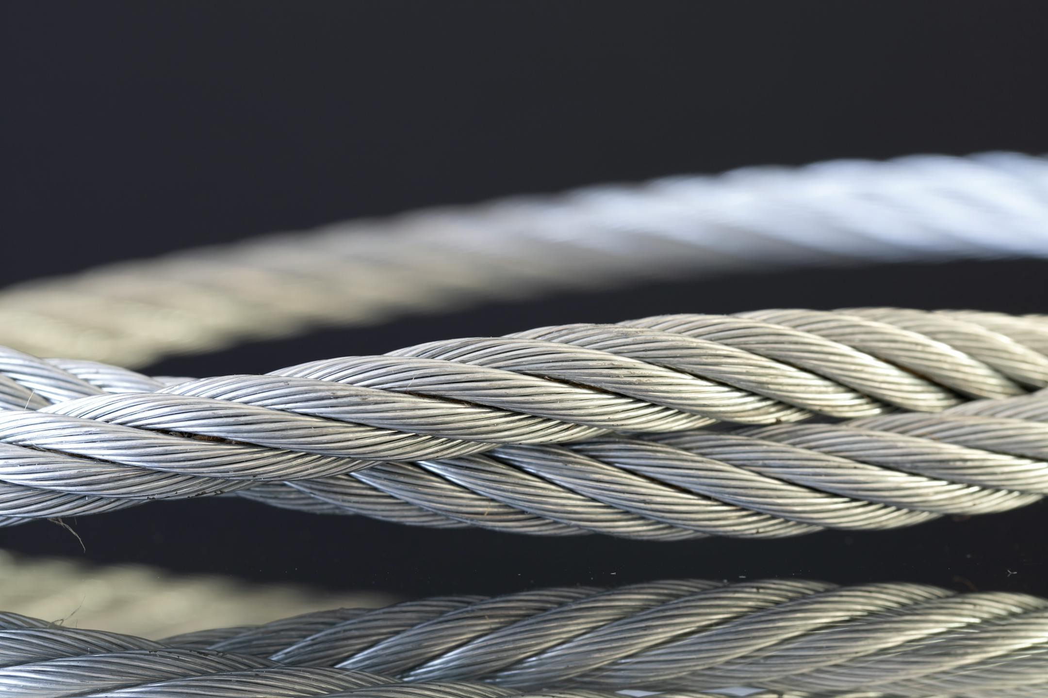 Detailed shot of twisted steel cables showcasing industrial strength and design.