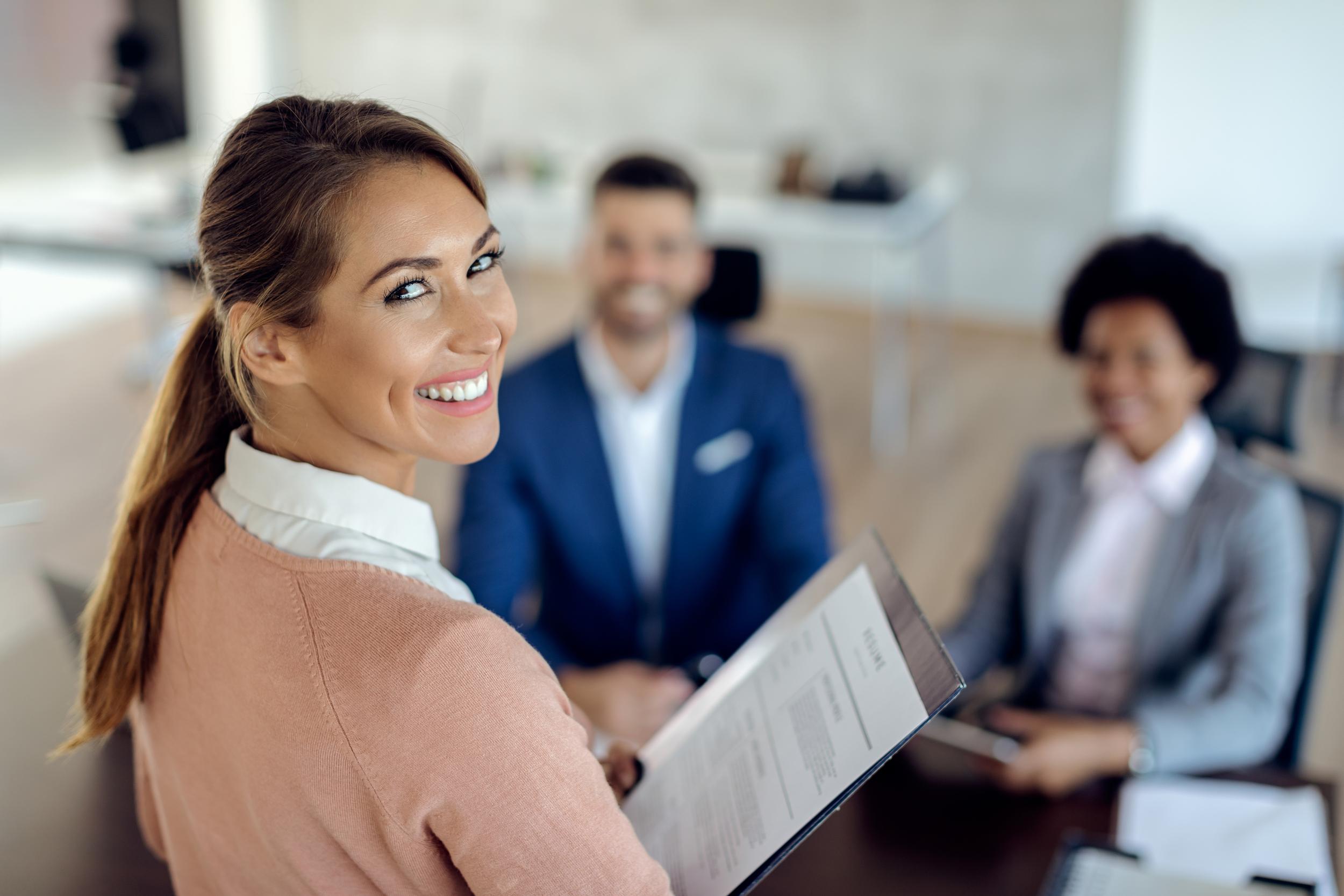 young-happy-woman-having-job-interview-office.jpg
