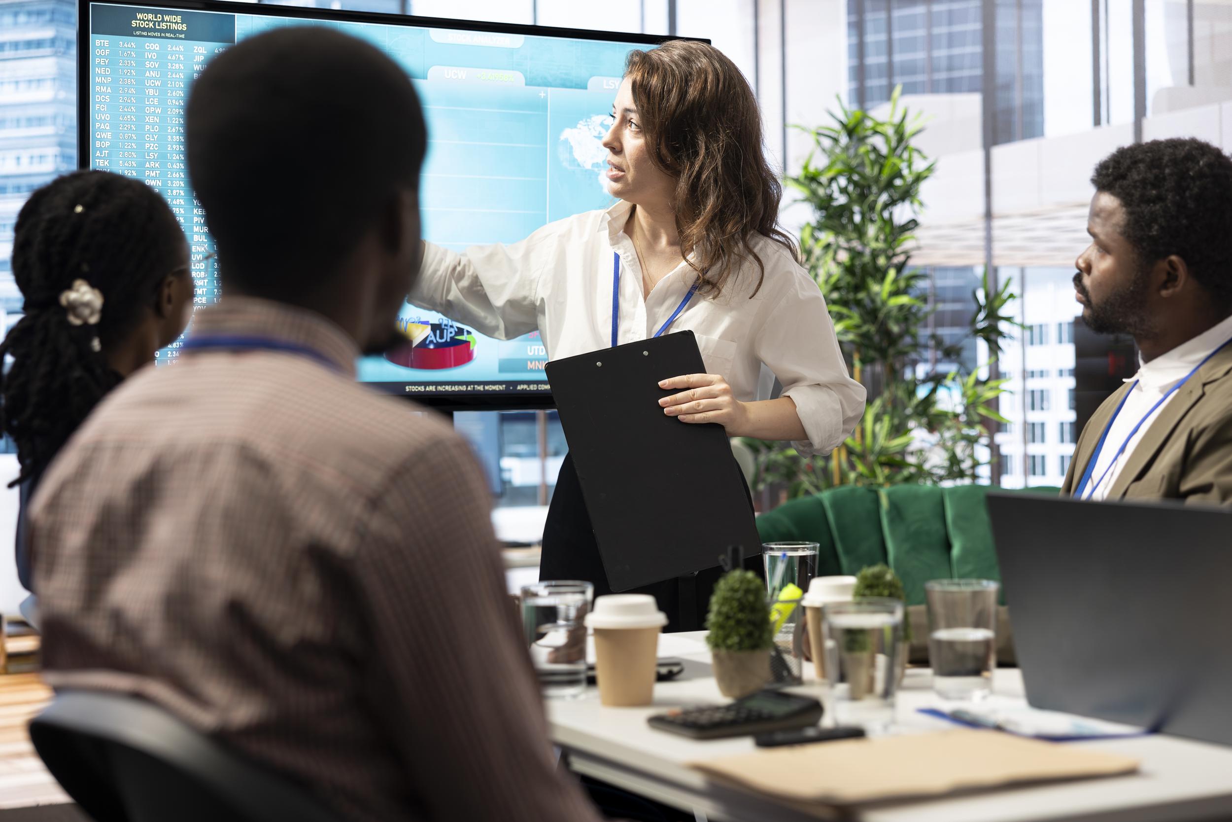 business-associates-reviewing-key-performance-indicators-within-enterprise.jpg