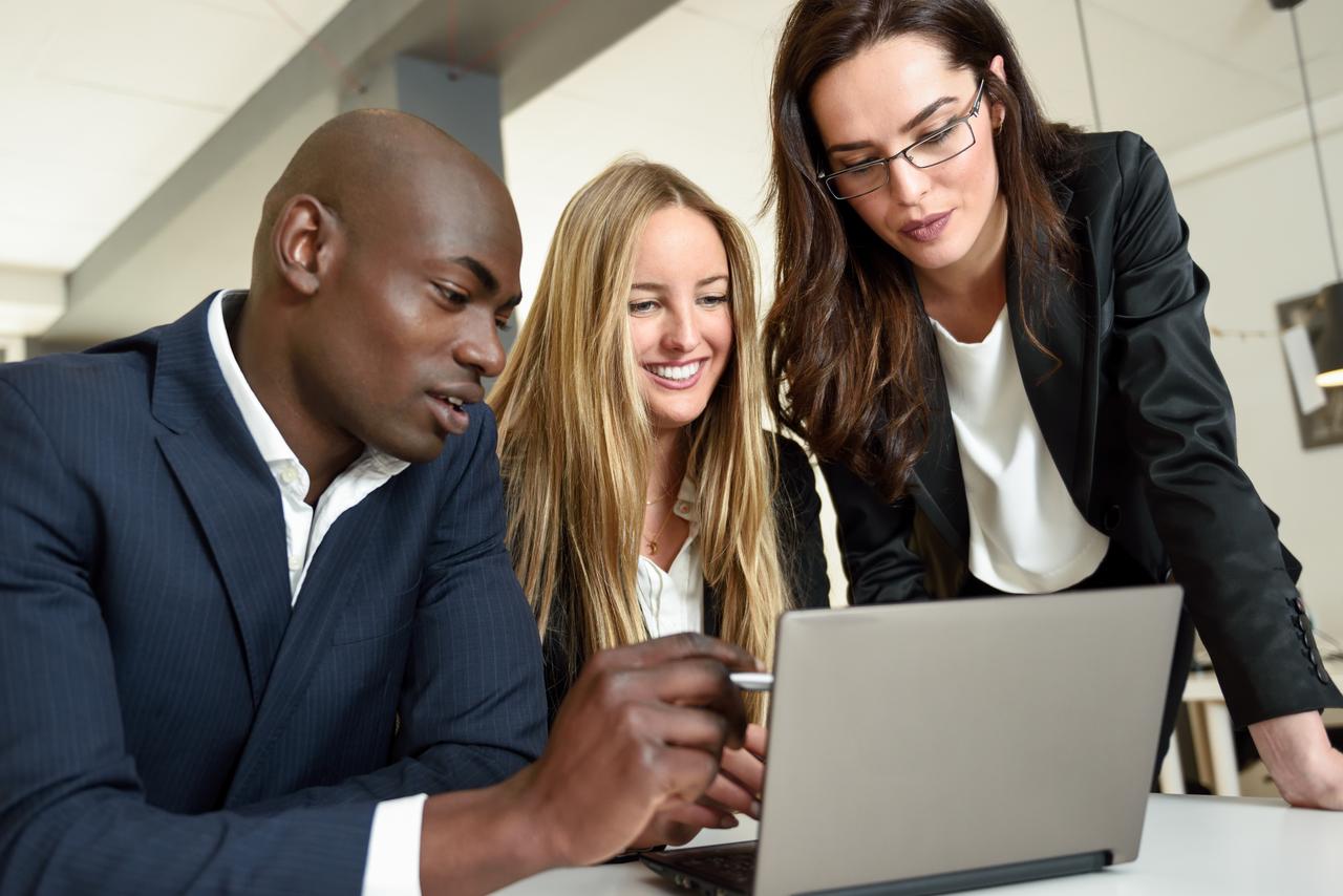 multi-ethnic-group-three-businesspeople-meeting-modern-office-two-caucasian-women-black-man-wearing-suit-looking-laptop-computer.jpg