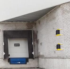 Wall Guardian protecting building corner from truck impact at loading dock