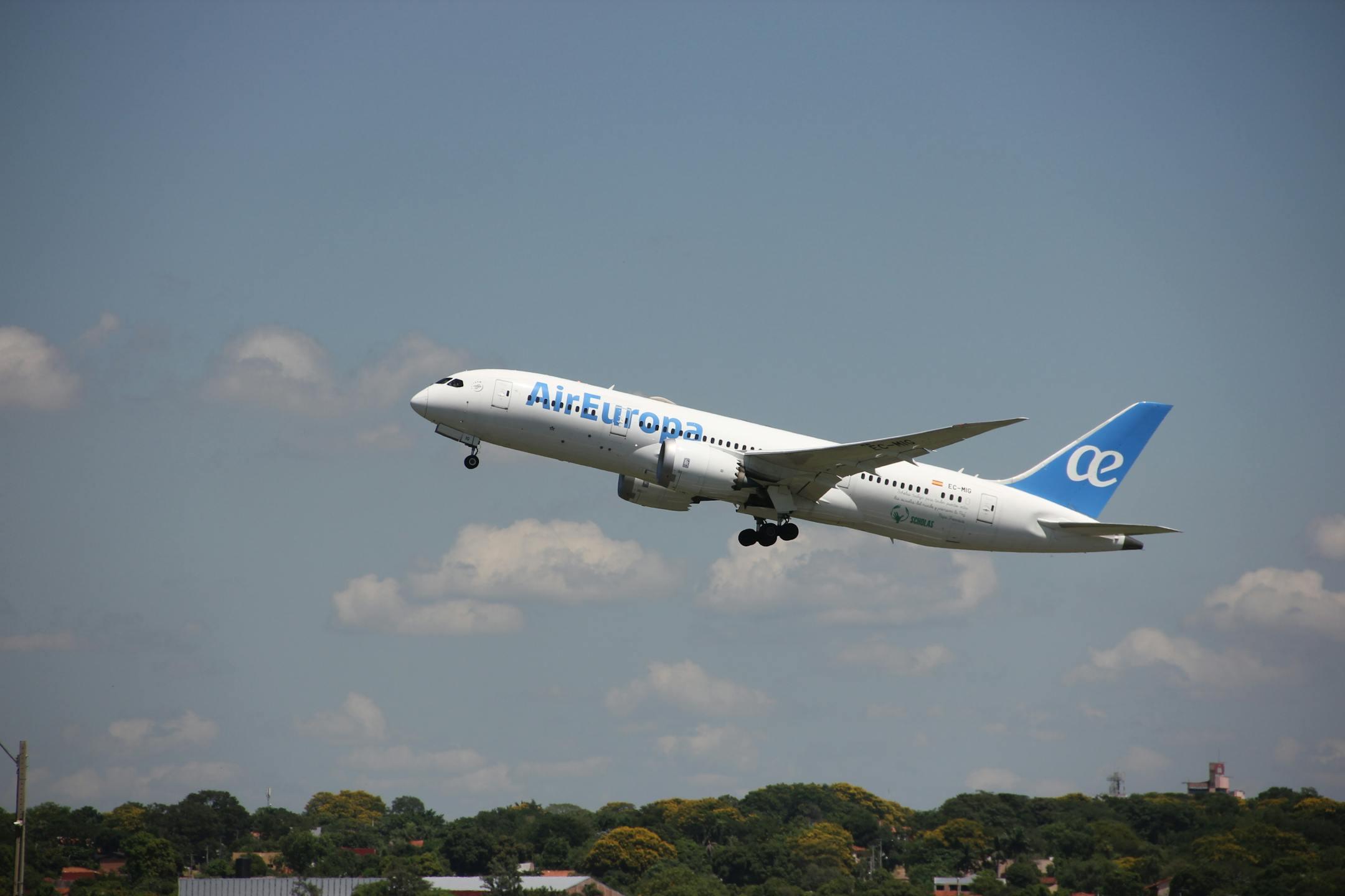 Air Europa airplane in flight during takeoff against a clear sky in Asunción, Paraguay.