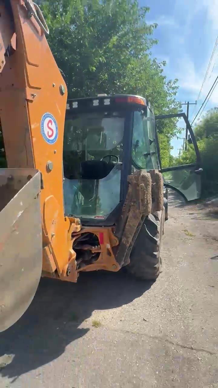 Excavation equipment prepared for an underground plumbing service-line project