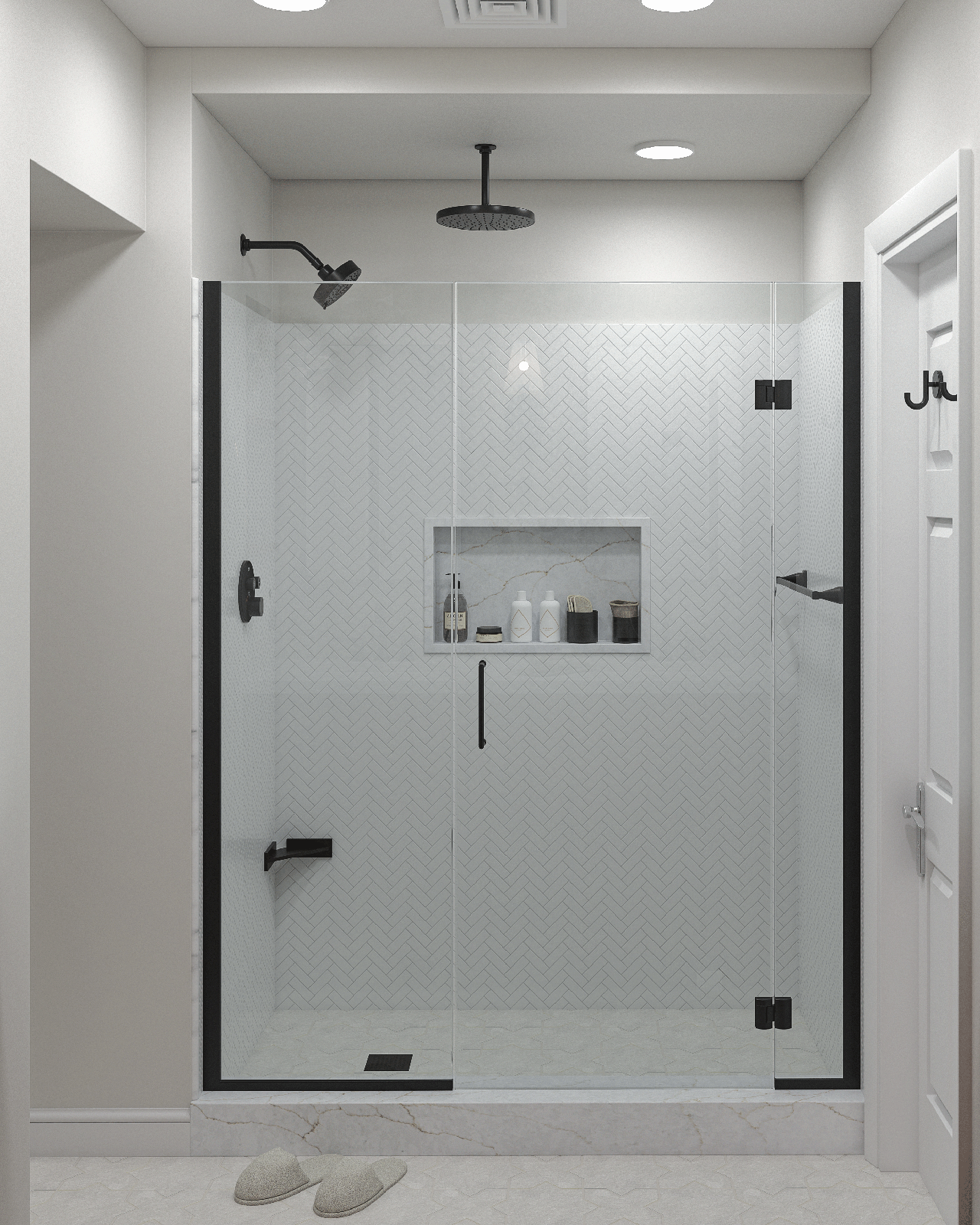 Herringbone tile shower stall with black fixtures