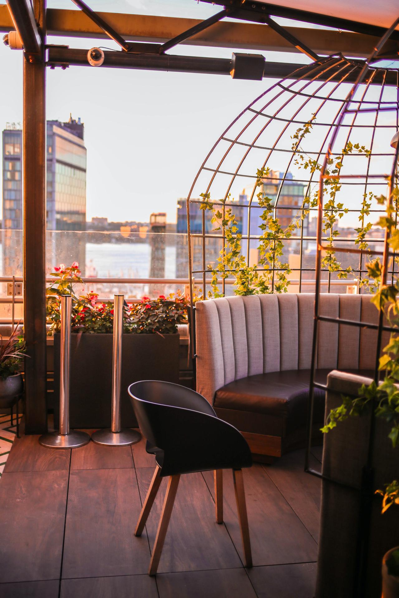 Sunset light on rooftop bar in city