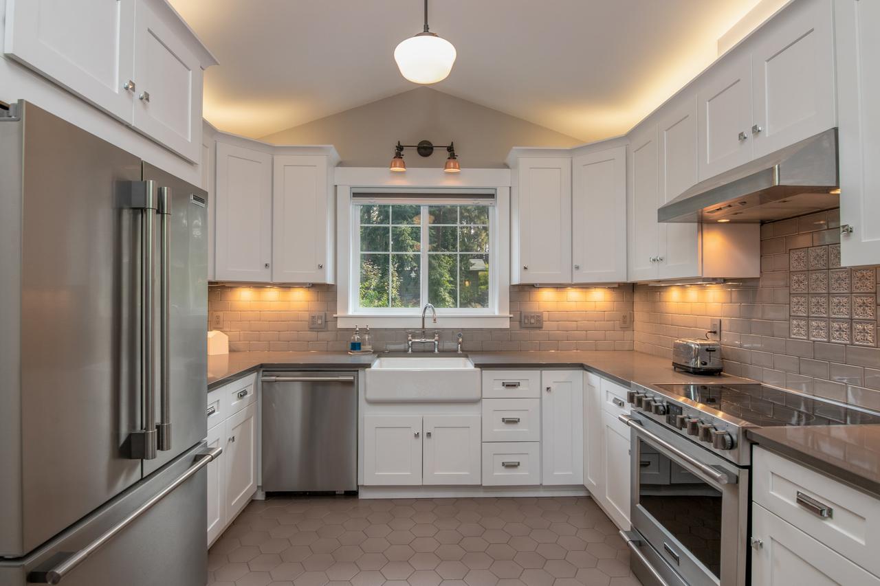 apartment-sized kitchen with steel appliances. 