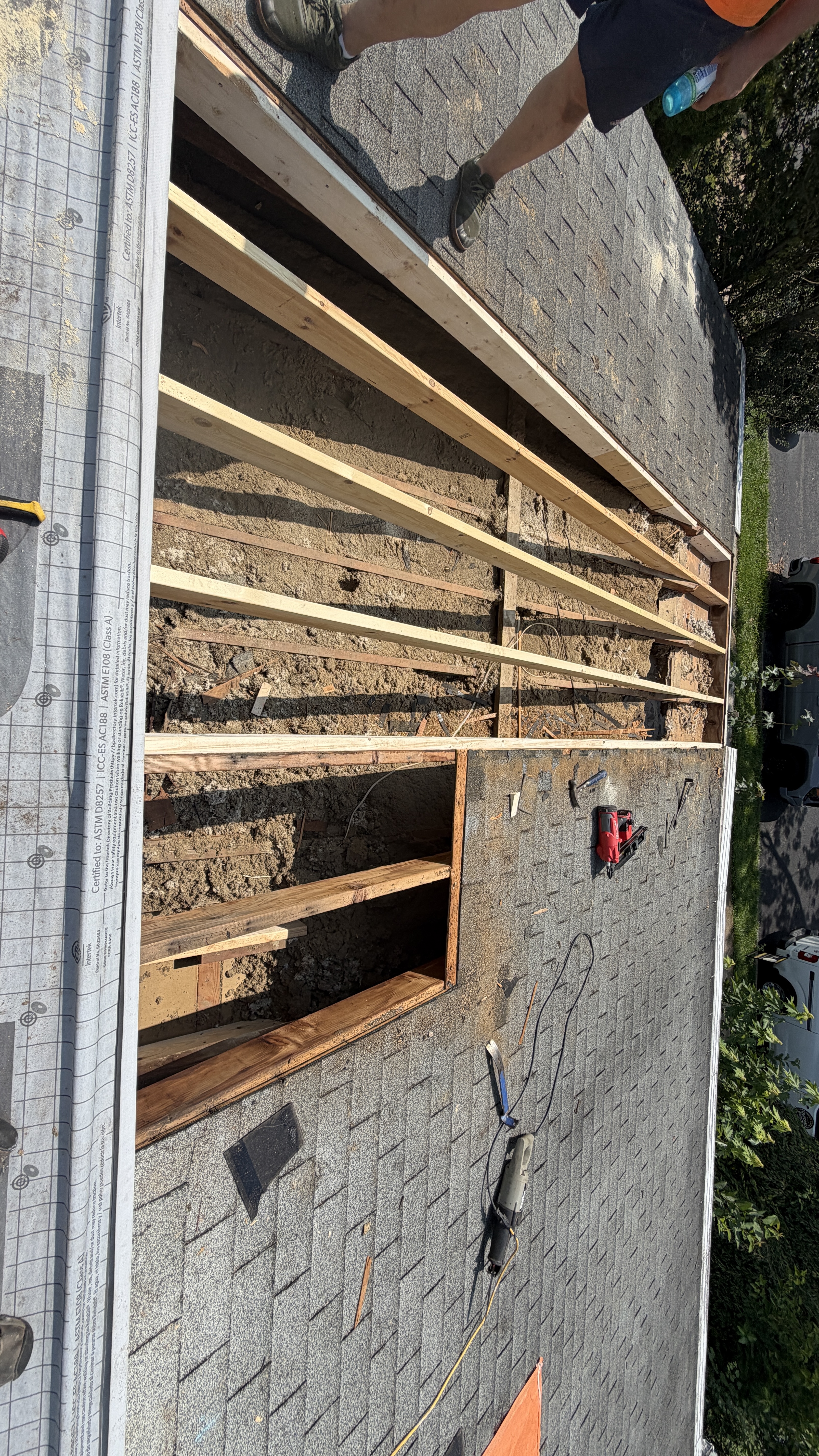 Professional roof decking installation showing quality wooden framing and structural support