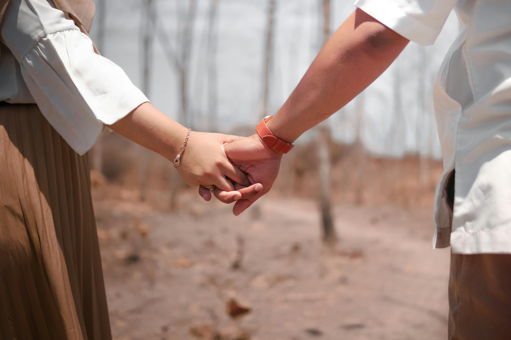 Couple holding hands