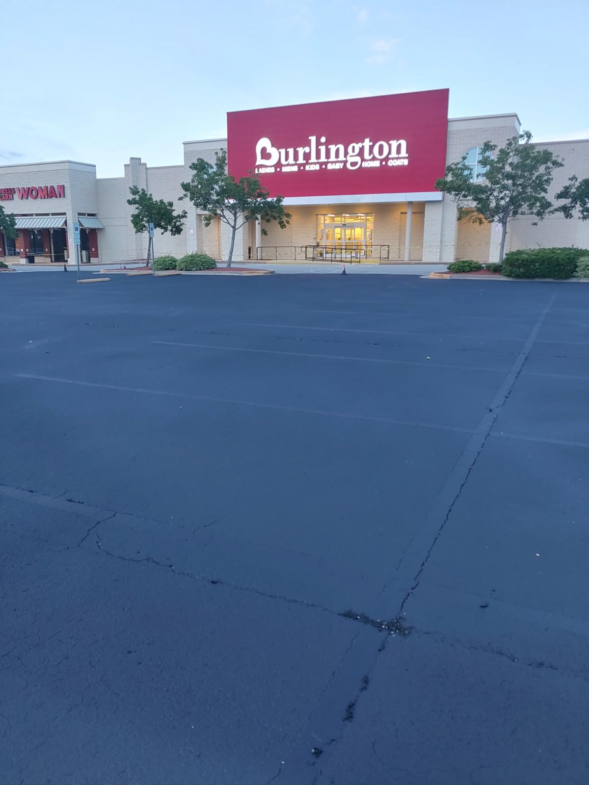 New asphalt repair work outside a large department store.