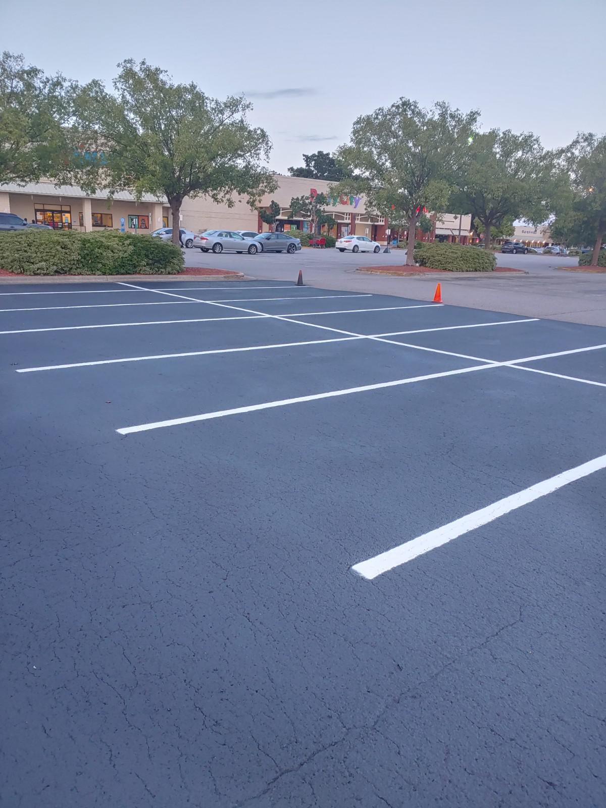 A parking lot with recent line striping work done.